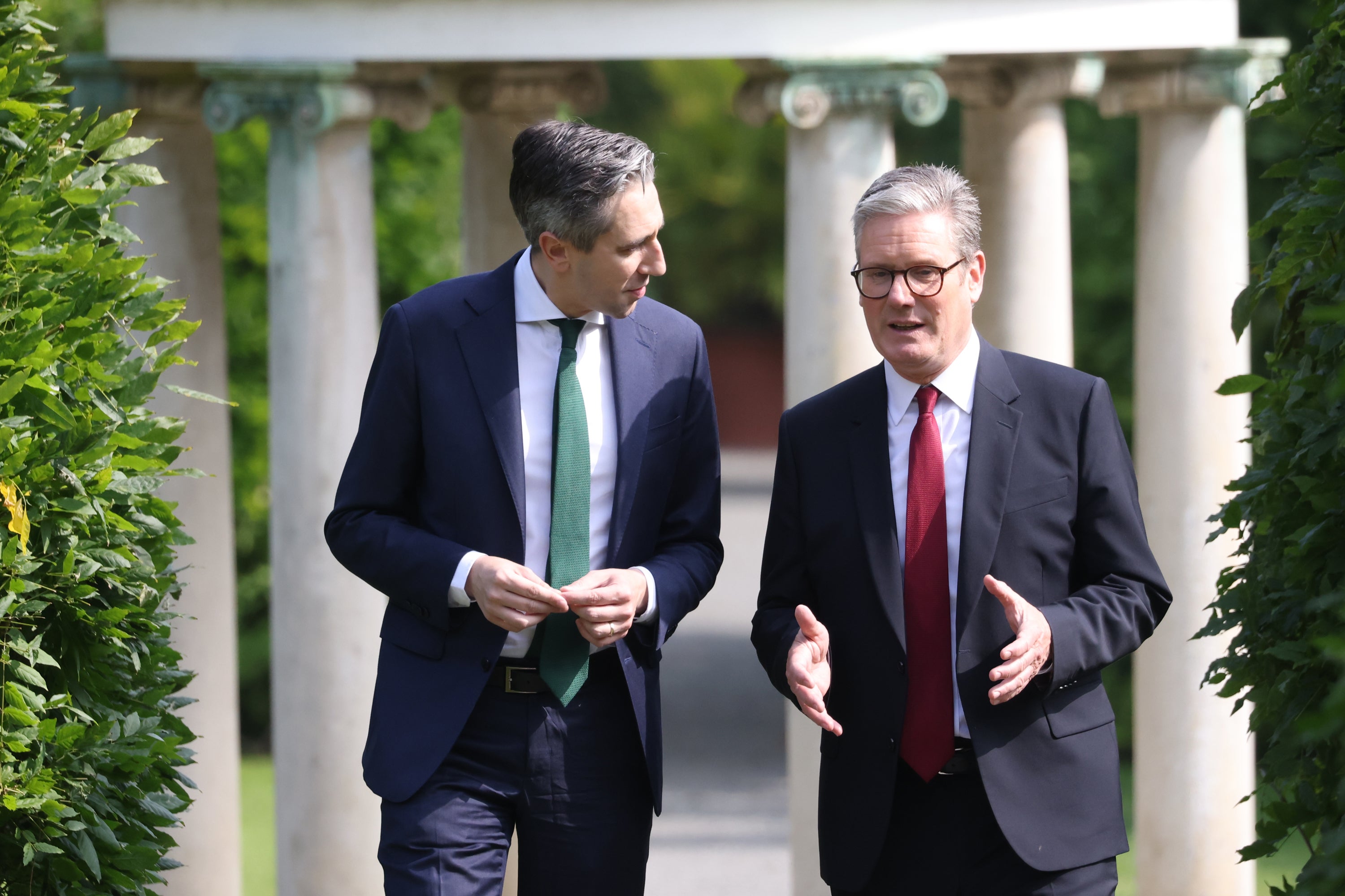 Taoiseach Simon Harris walks with Prime Minister Sir Keir Starmer at Farmleigh House