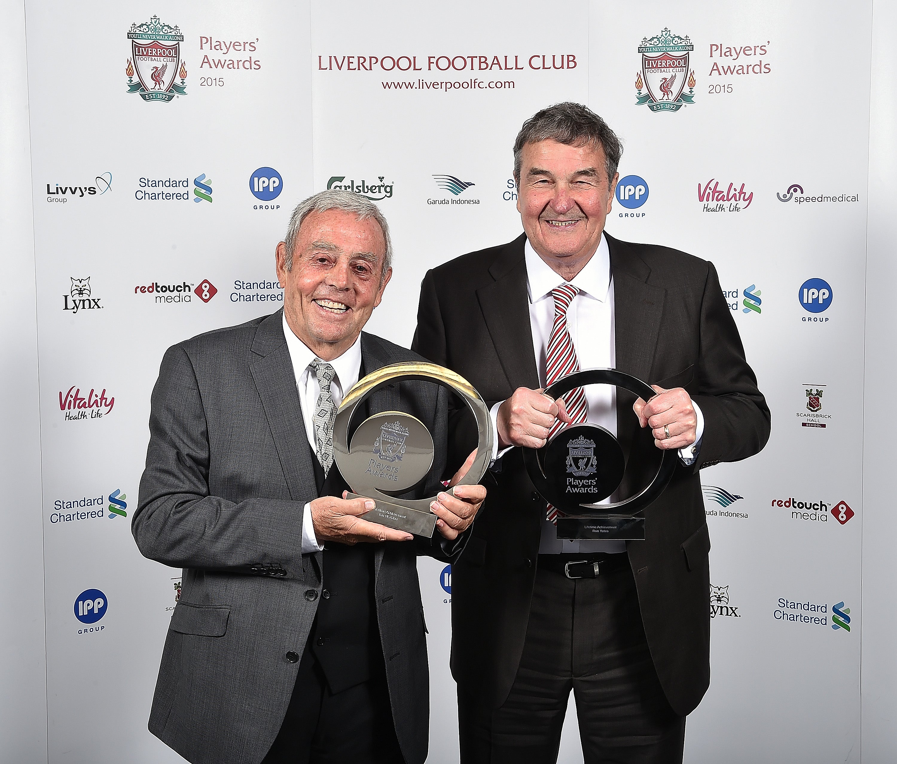 Ian St John, left, and Yeats celebrate winning Liverpool FC’s lifetime achievement award in 2015