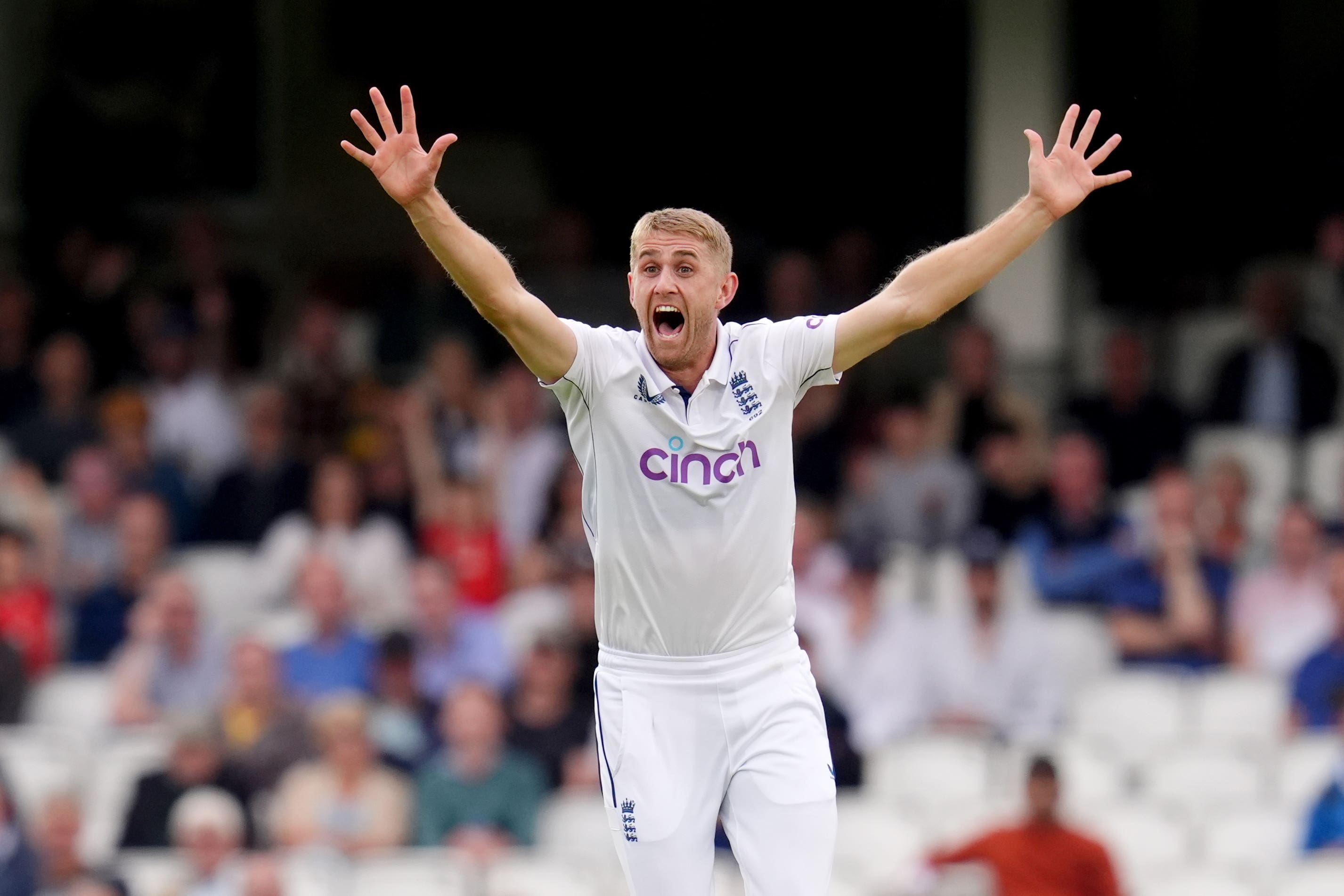 Olly Stone celebrates taking the wicket of Sri Lanka’s Dinesh Chandimal (John Walton/PA)