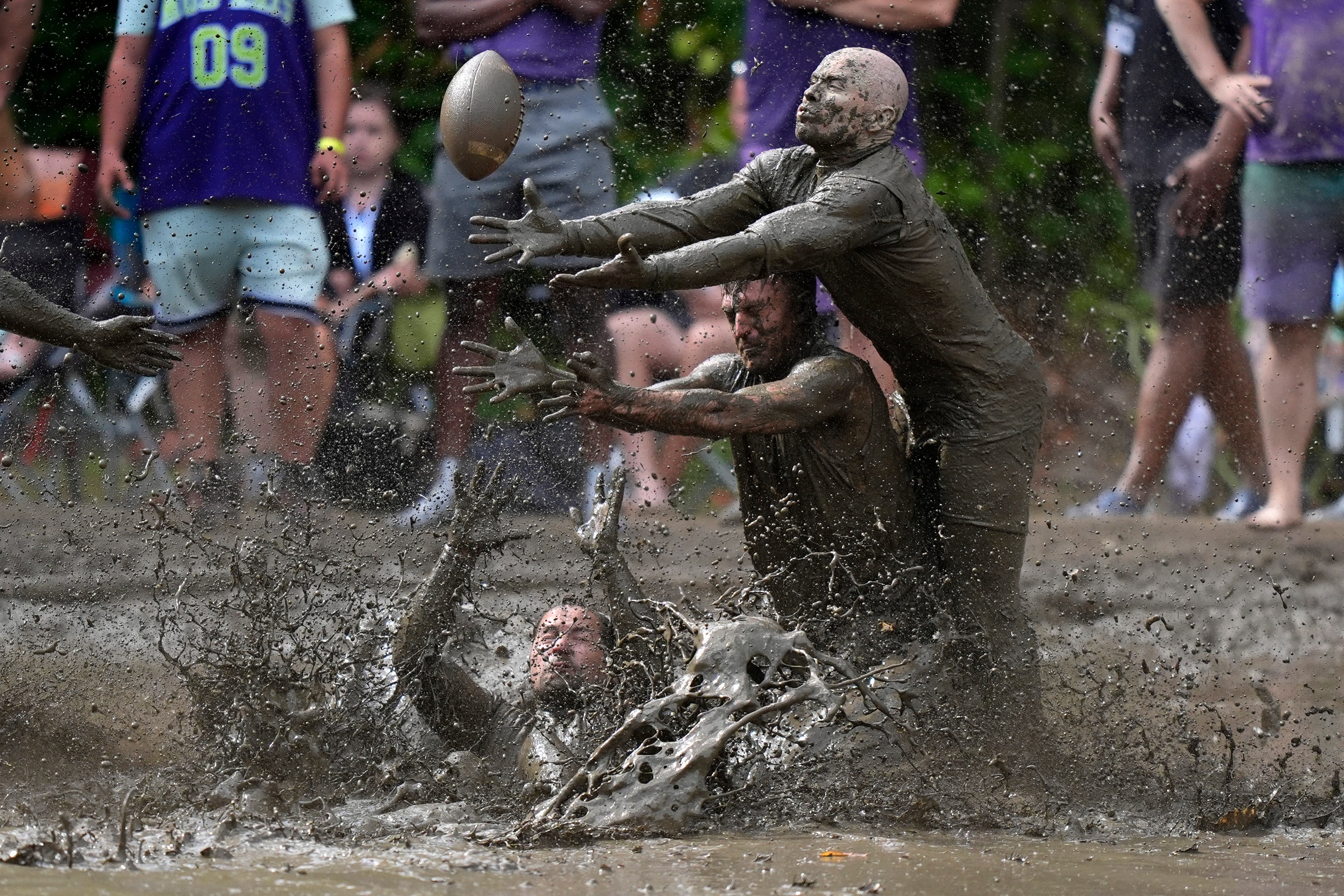 APTOPIX Mud Bowl Football
