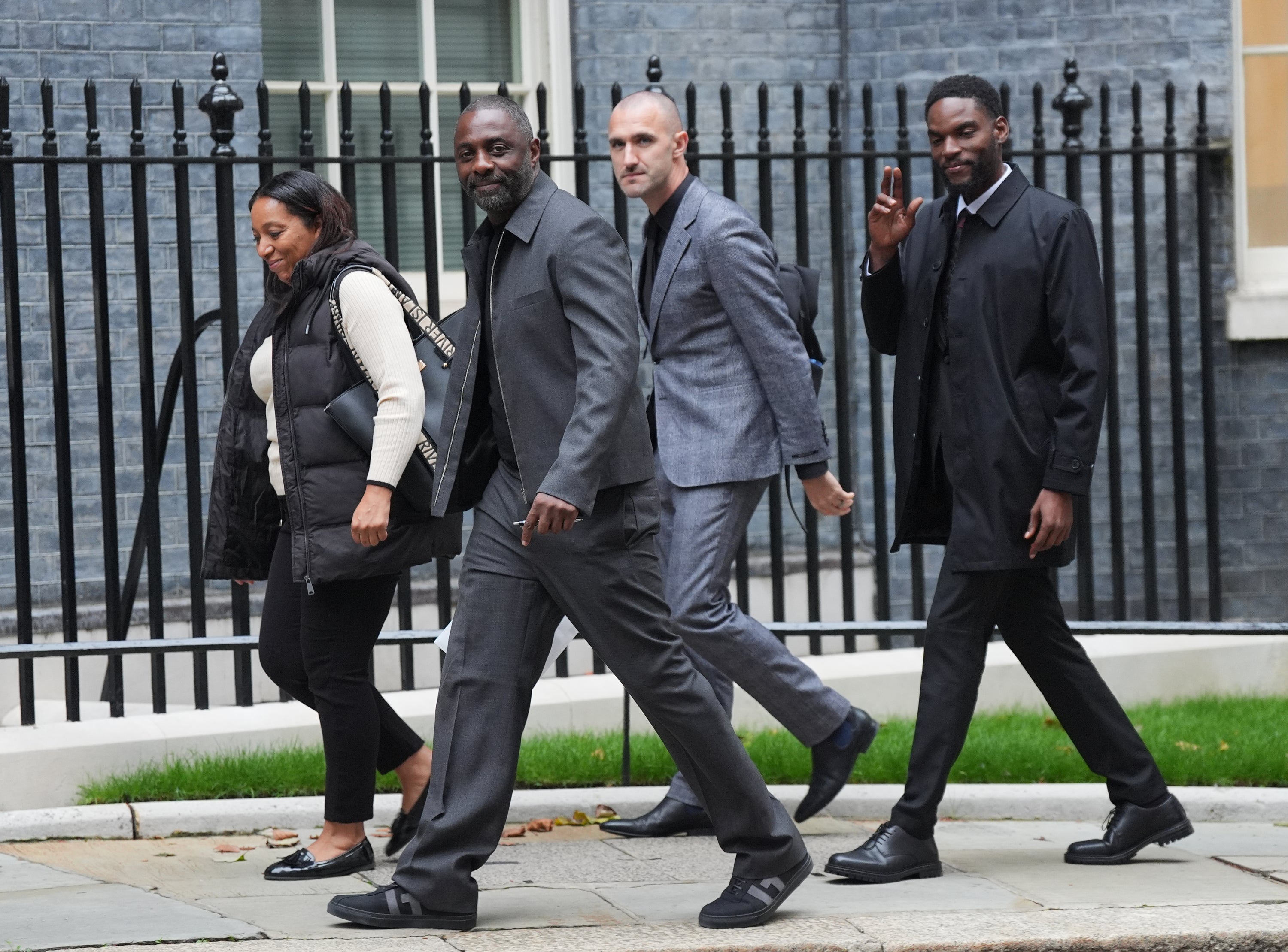 Idris Elba, Faron Paul and anti-knife crime campaigners walking into No 10 Downing Street on Tuesday