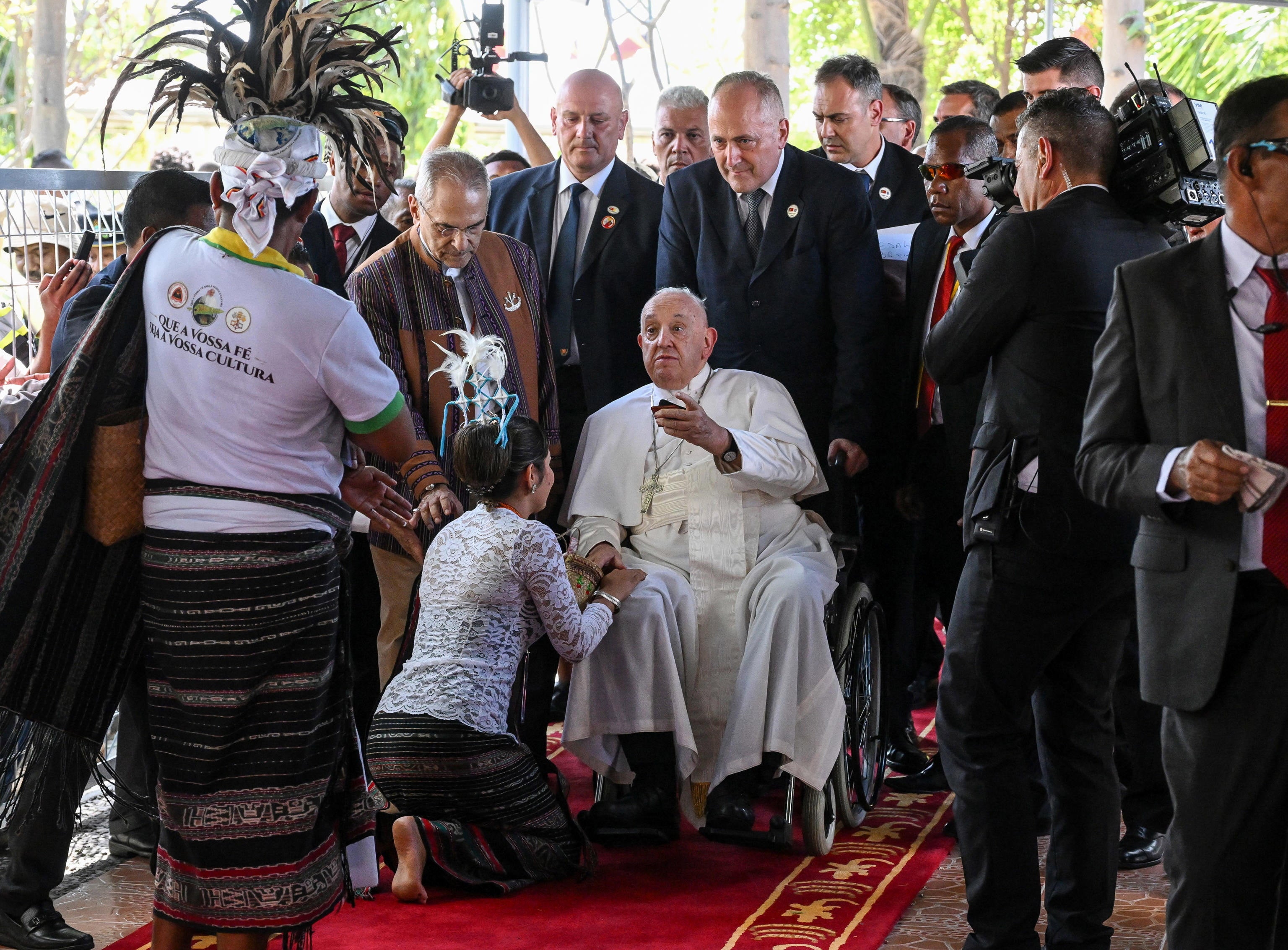 Pope Francis attends a welcoming ceremony as he arrives in Dili