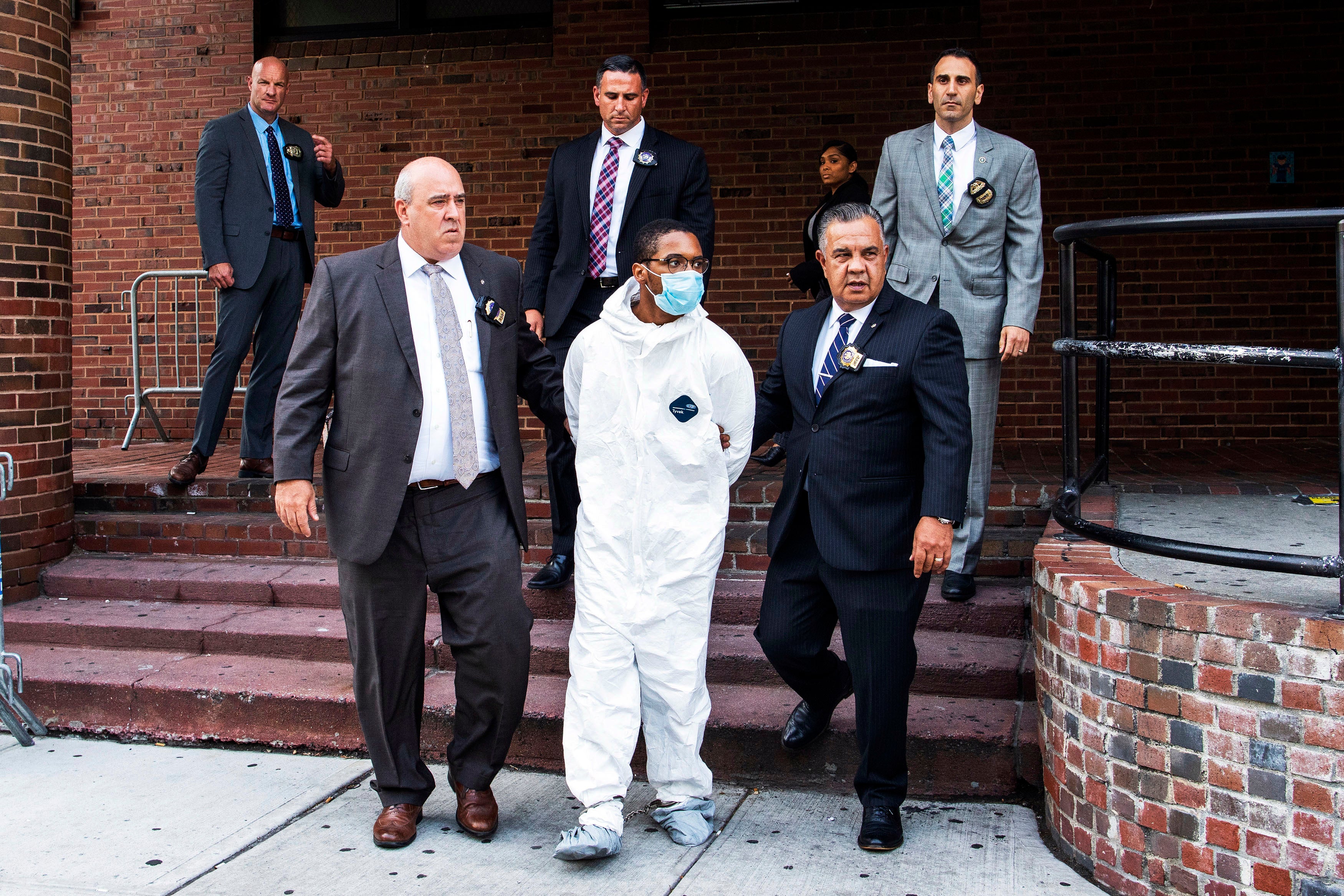 Tyrese Haspil is escorted out of the 7th precinct by NYPD detectives, July 17, 2020, in New York.