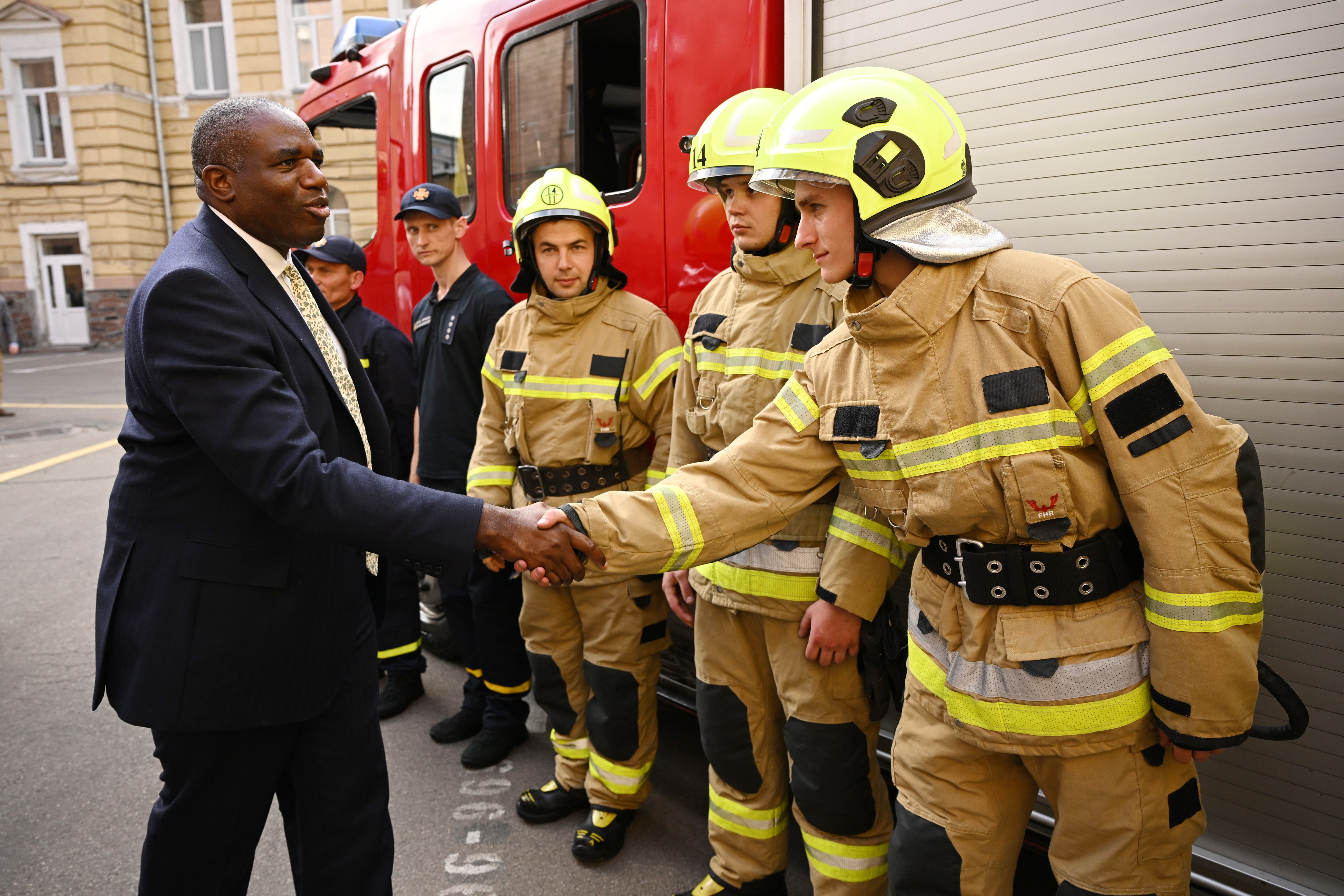 Foreign Secretary David Lammy meets members of the emergency services during a visit to Kyiv (Leon Neal/PA)