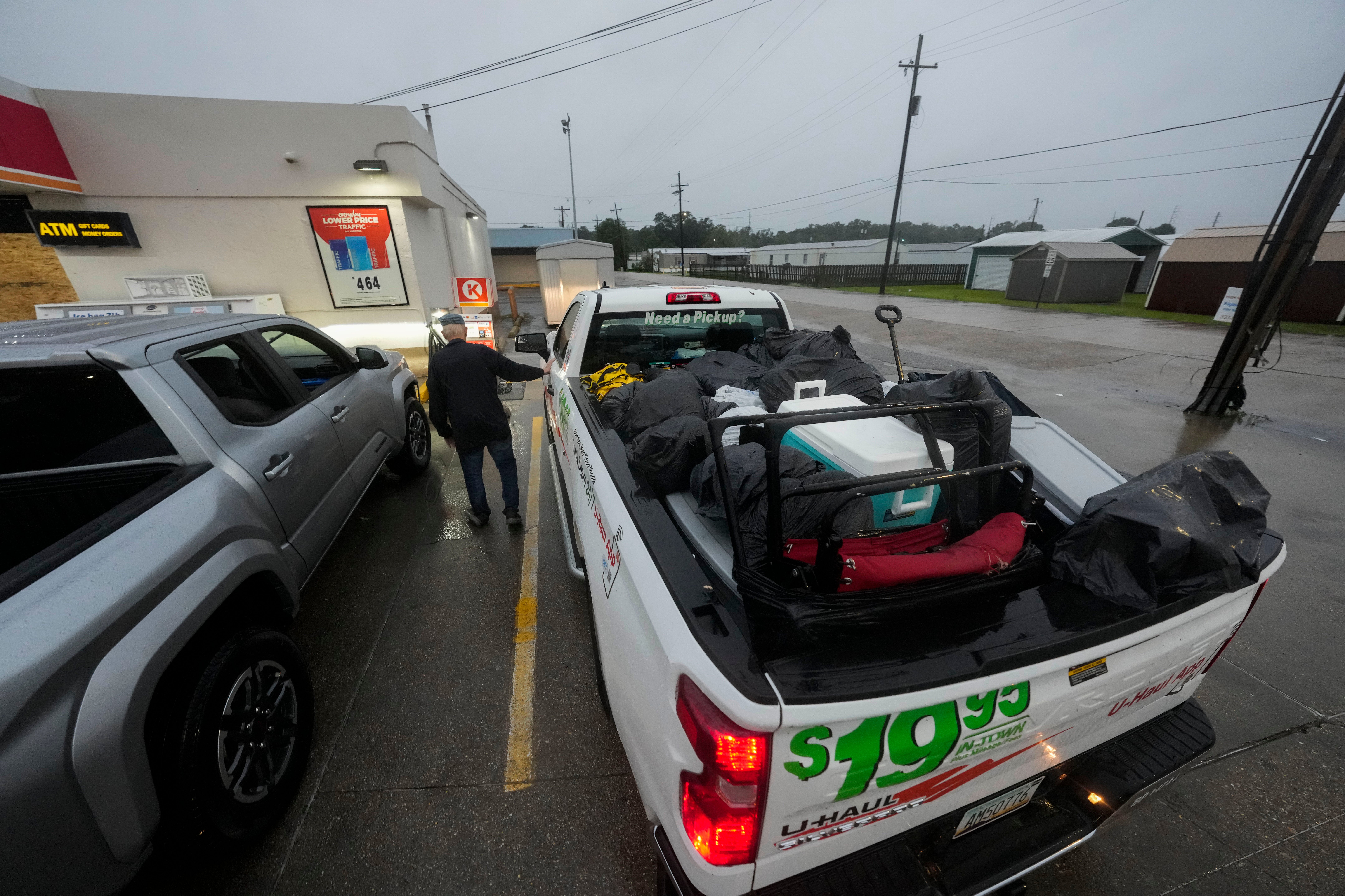 Pat Simon, a resident of Morgan City, stops at a gas station as he evacuates to a hotel on Wednesday. Morgan City announced a curfew for residents ahead of the storm through Thursday morning.