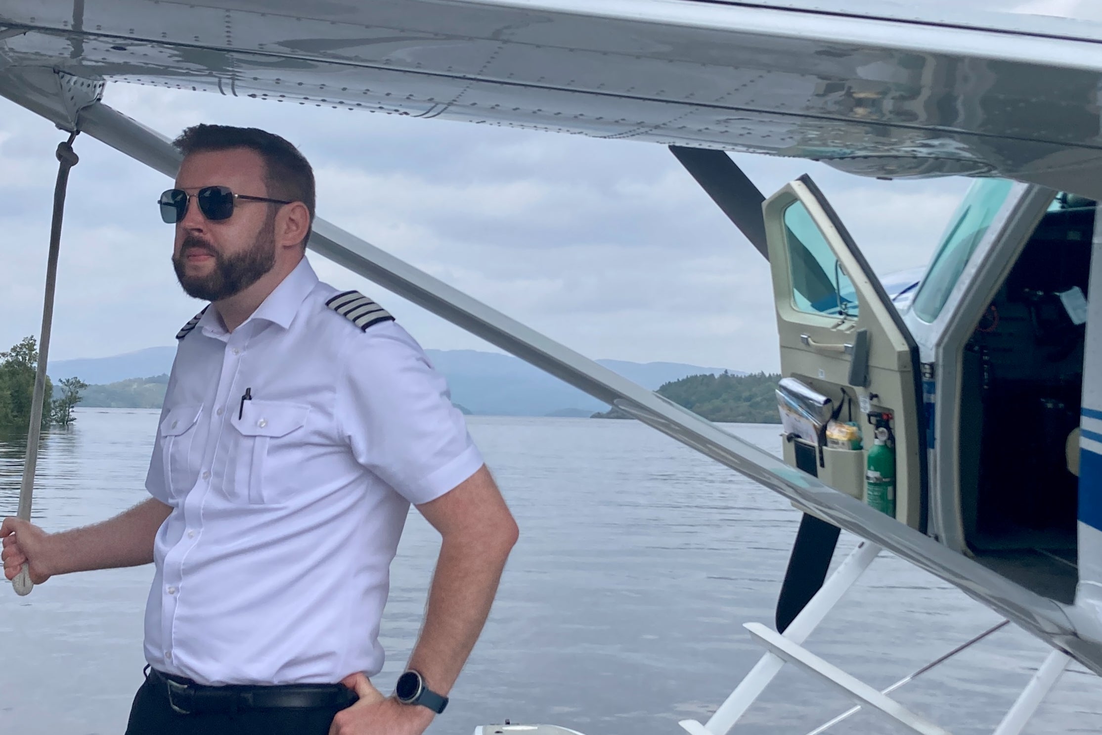 High flier: pilot John beside the plane as it waits on Loch Lomond