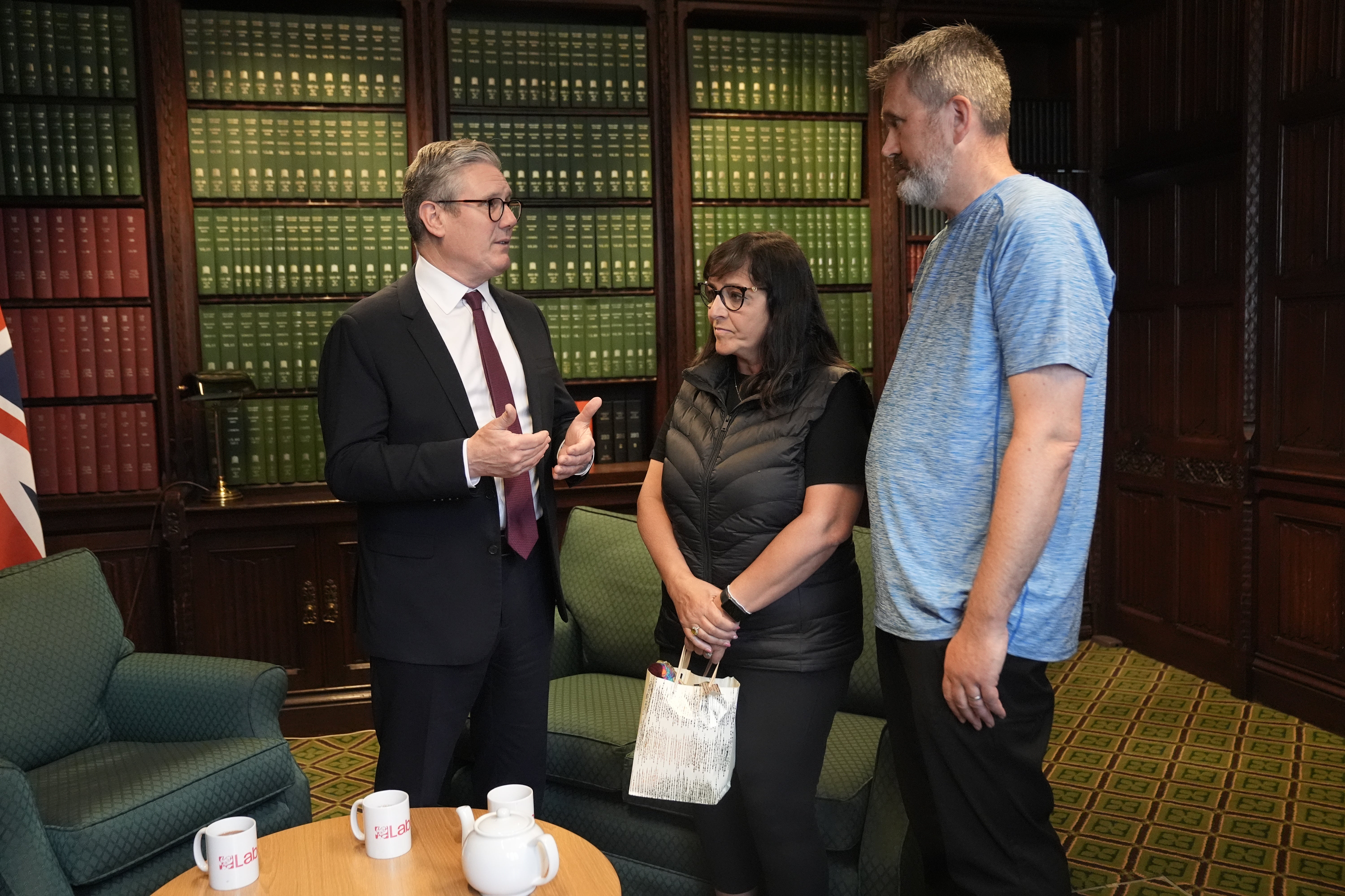 Figen Murray, mother of Manchester Arena bombing victim Martyn Hett, and her husband Stuart speaking to Sir Keir Starmer about Martyn’s Law (Stefan Rousseau/PA)