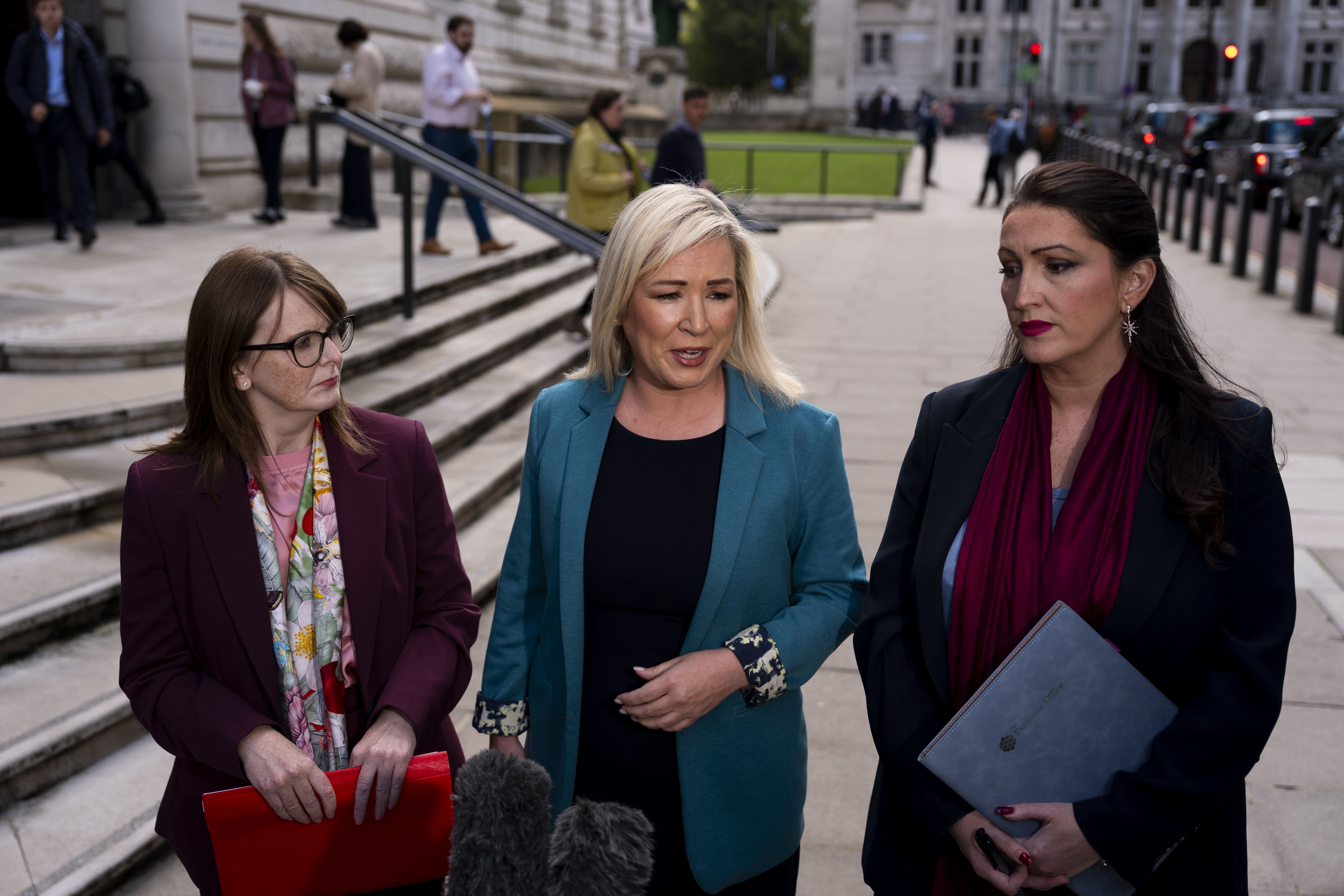 Northern Ireland’s Finance Minister Caoimhe Archibald (left), First Minister Michelle O’Neill (centre) and deputy First Minister Emma Little Pengelly talk to the media before meeting Chancellor Rachel Reeves at the Treasury in London (Jordan Pettitt/PA)