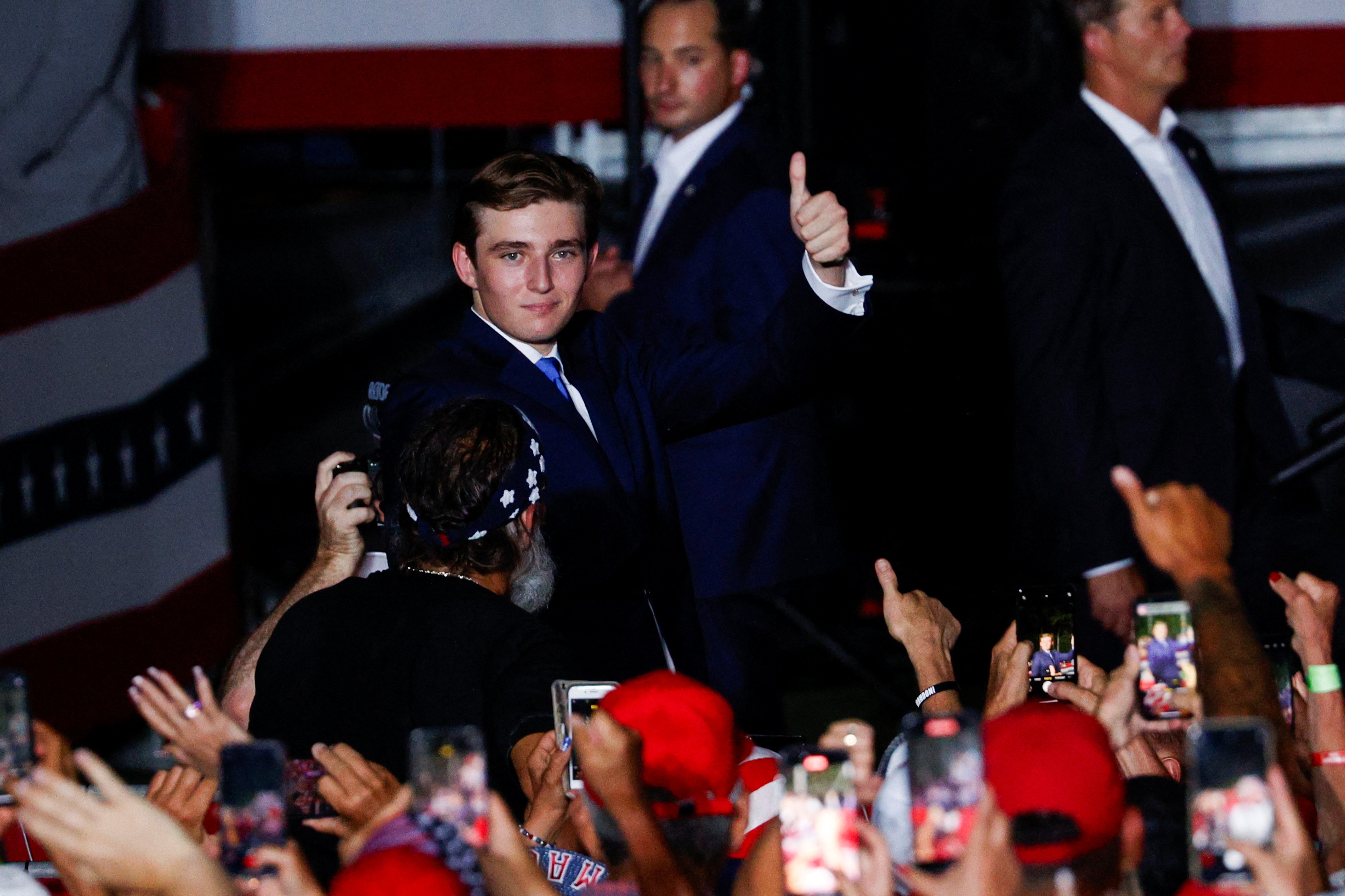 Barron Trump, only child of Donald and Melania, gives a thumbs-up at his father’s campaign event in Florida