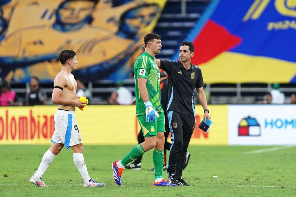 Martinez walks off the pitch after the defeat