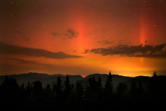 <p>Flares of northern lights colour sky over White Mountains just after midnight</p>