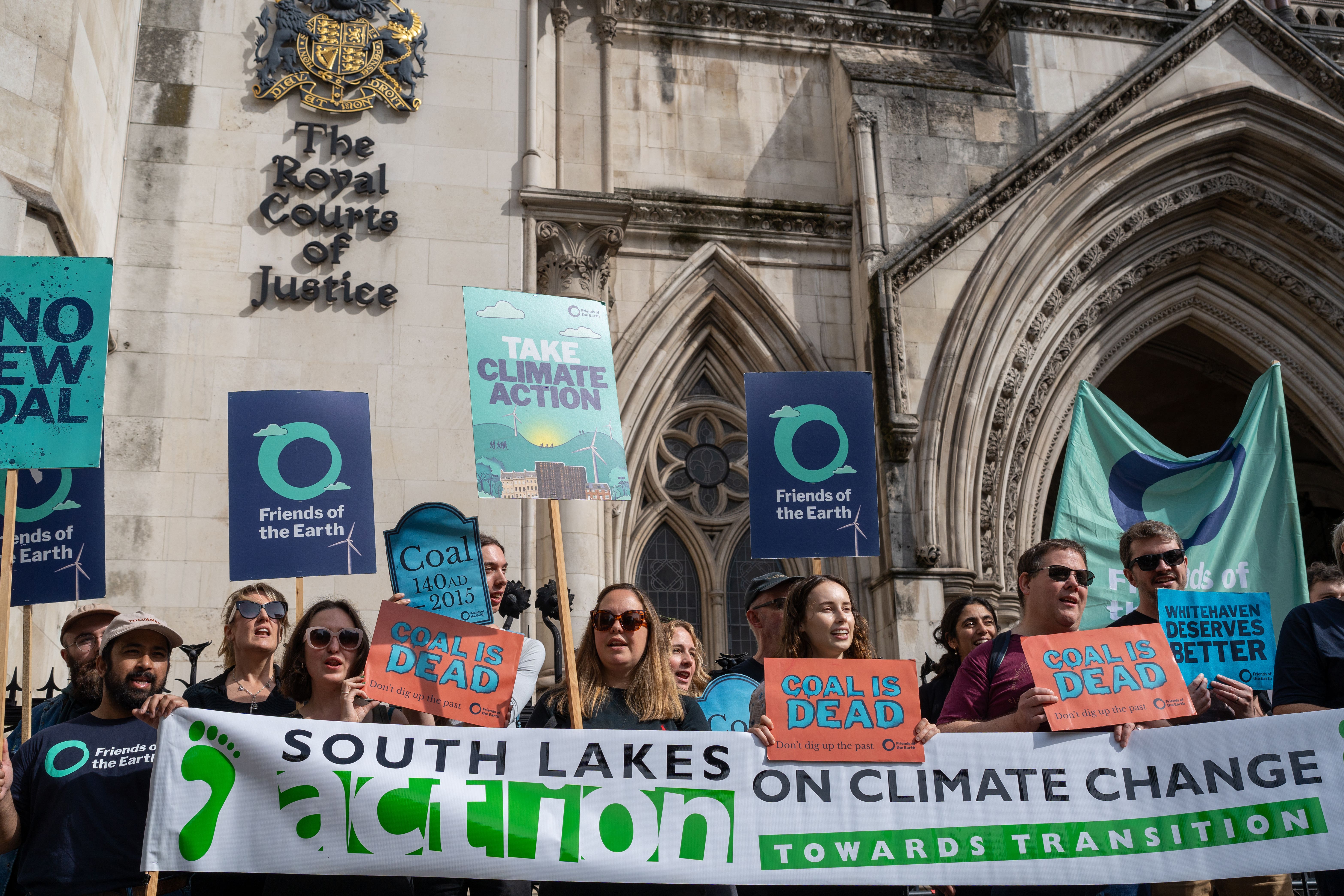 Activists outside the Royal Courts of Justice for the hearing in July (Jonathan Salariya/Friends of the Earth/PA)