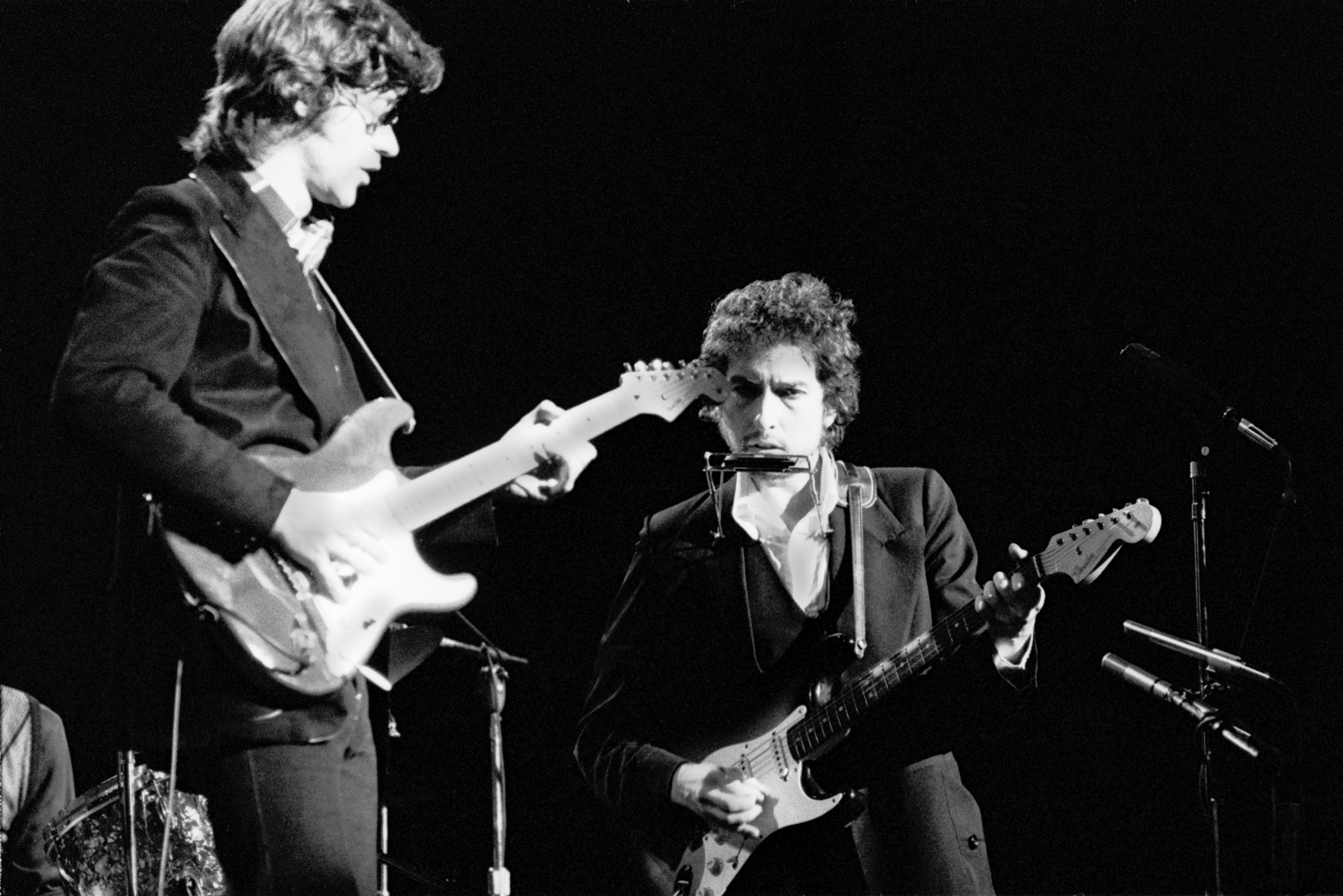 Bob Dylan performs live on stage with Robbie Robertson of The Band at Madison Square Garden, New York as part of his 1974 Tour Of America on 30 January 1974