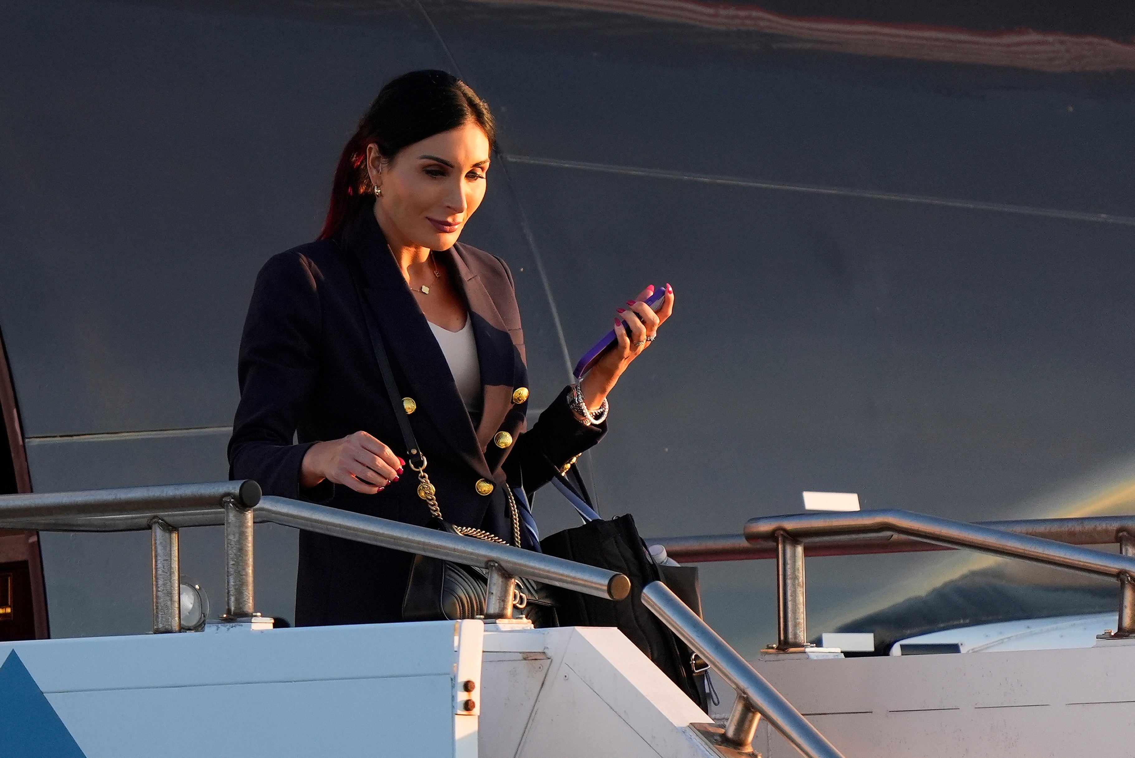 Laura Loomer arrives with Republican presidential nominee former president Donald Trump at Philadelphia International Airport on Tuesday September 10 for the presidential debate