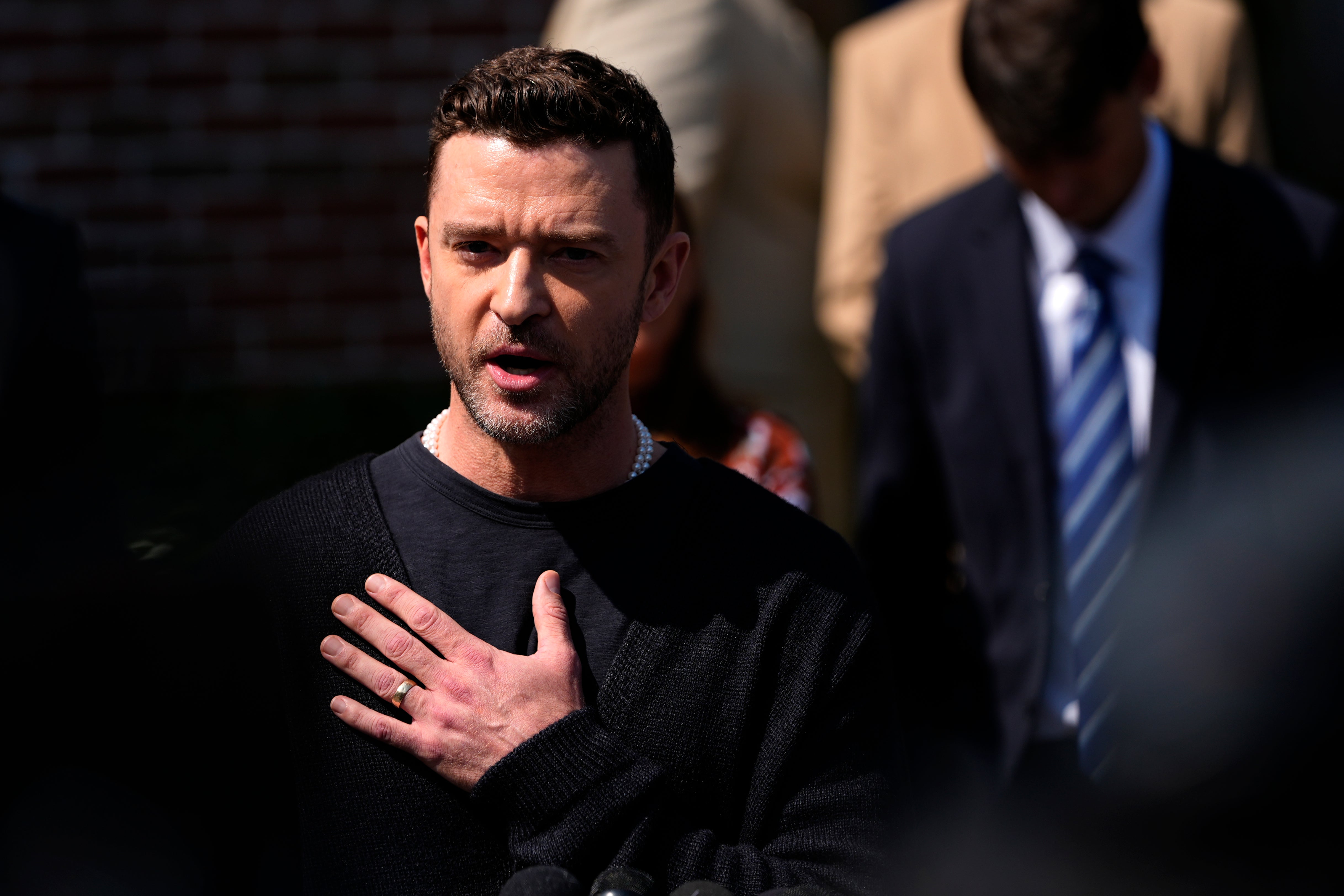 Justin Timberlake addressing the press outside a New York courthouse