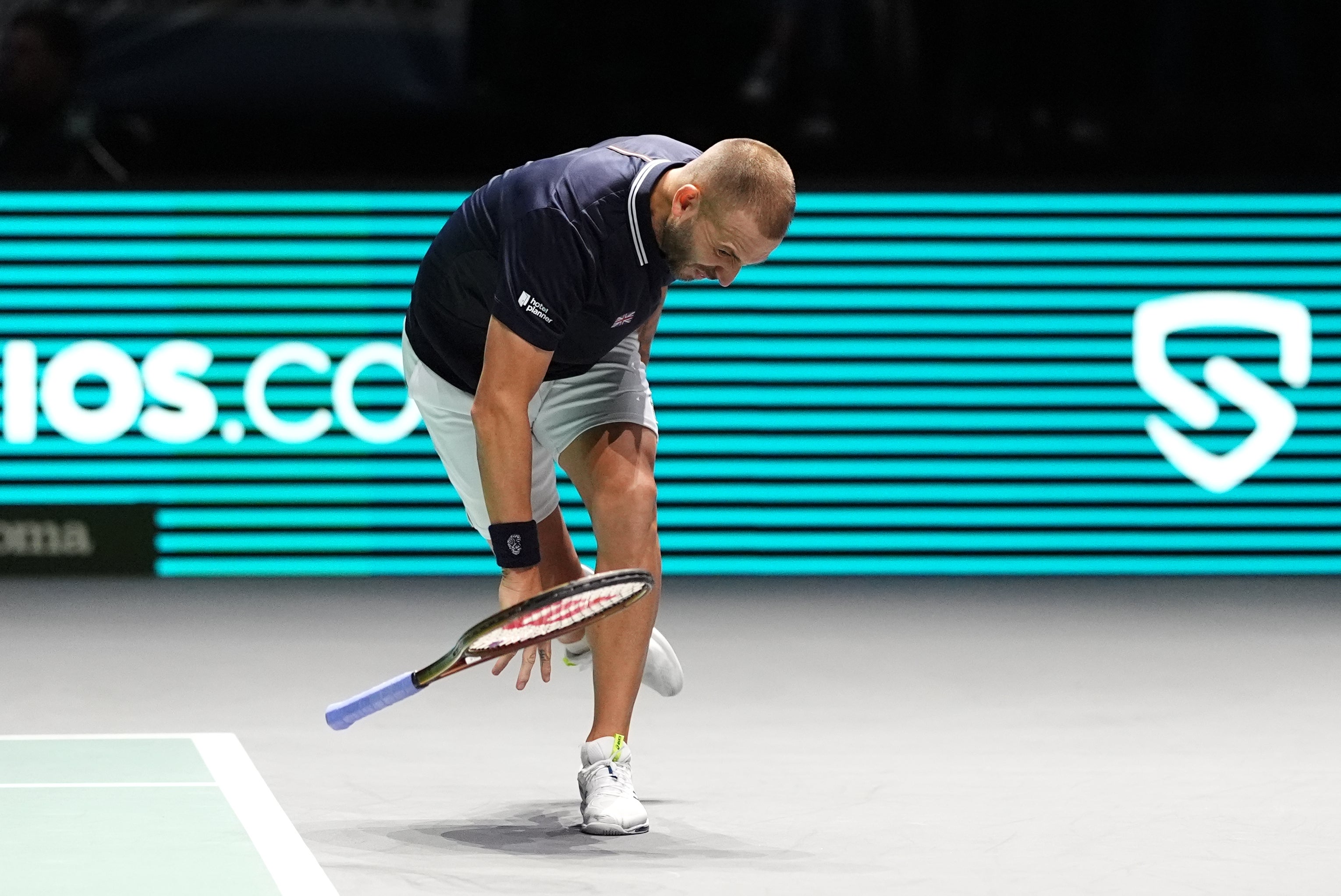 Dan Evans slams his racket down in frustration