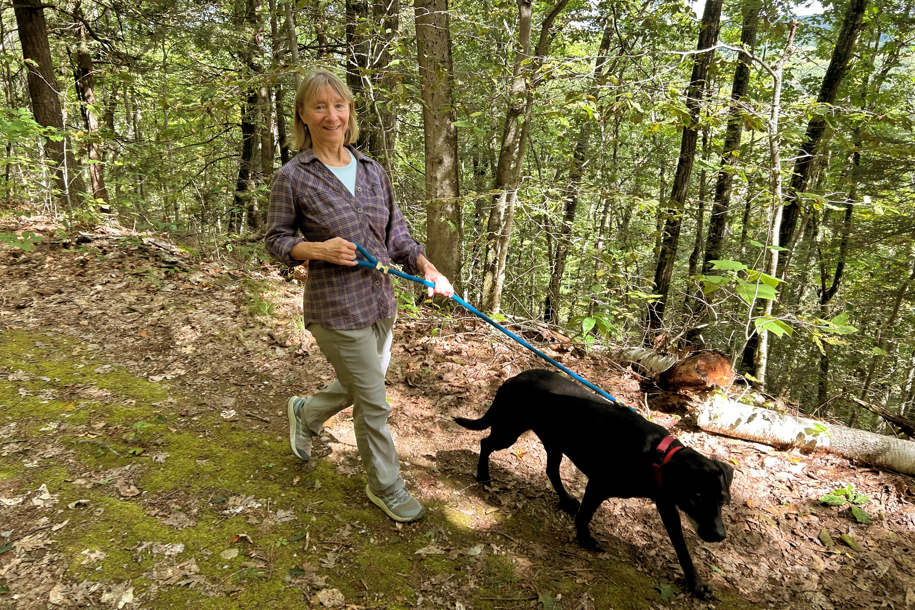 Susannah Johnston, of Croton-on-Hudson, N.Y., walks her dog Ellie on Sept. 8, 2024