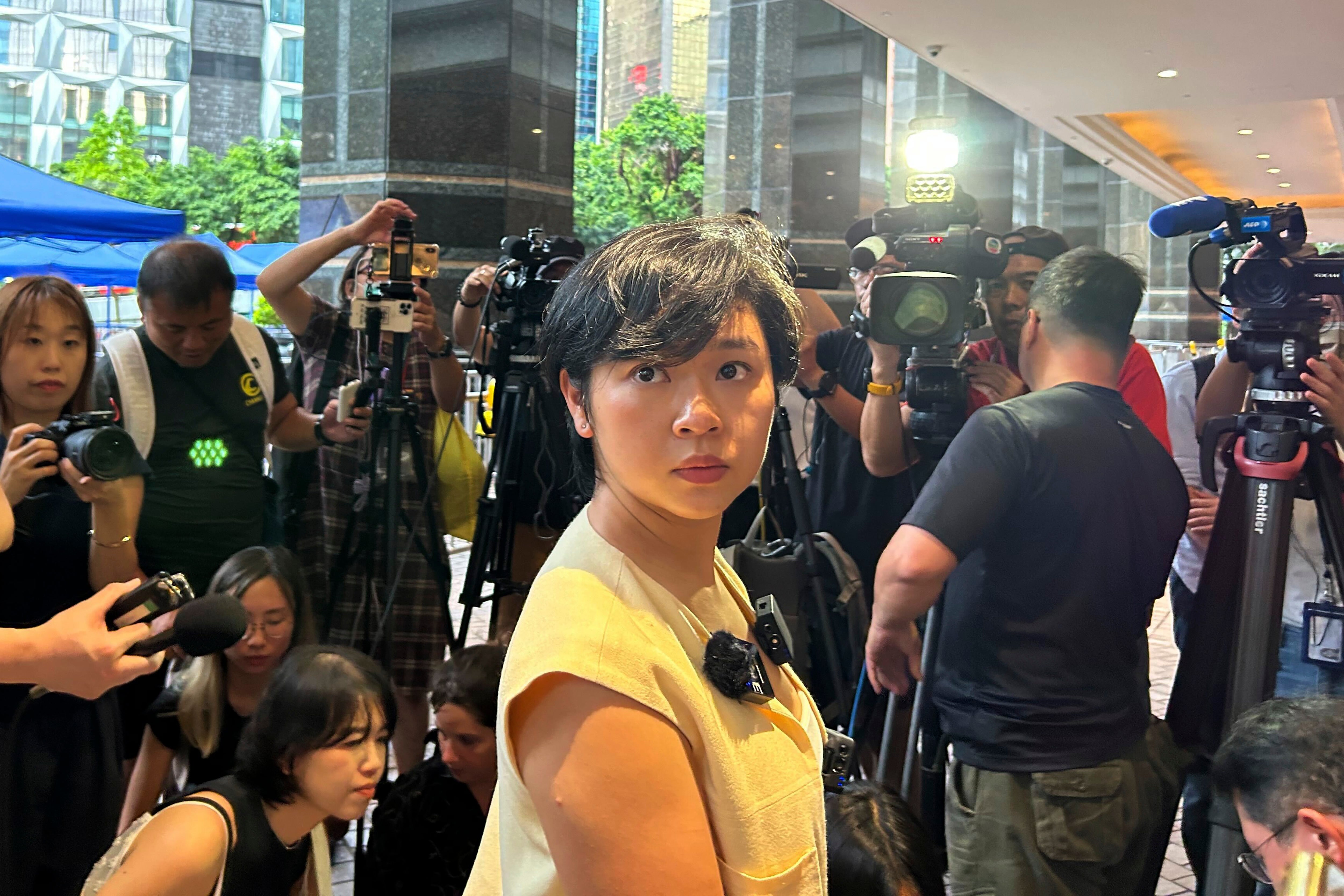 Selina Cheng, chair of the Hong Kong Journalists Association, speaks to the media