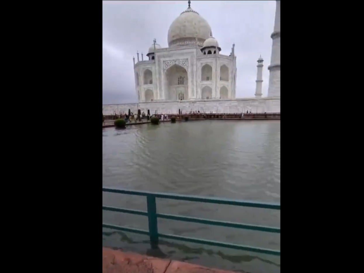 A still image from a video of Taj Mahal shows water flooding the garden of the monument