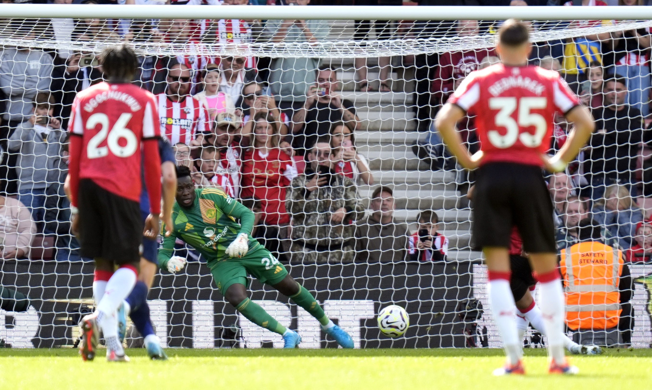 Manchester United’s Andre Onana saves Cameron Archer’s penalty