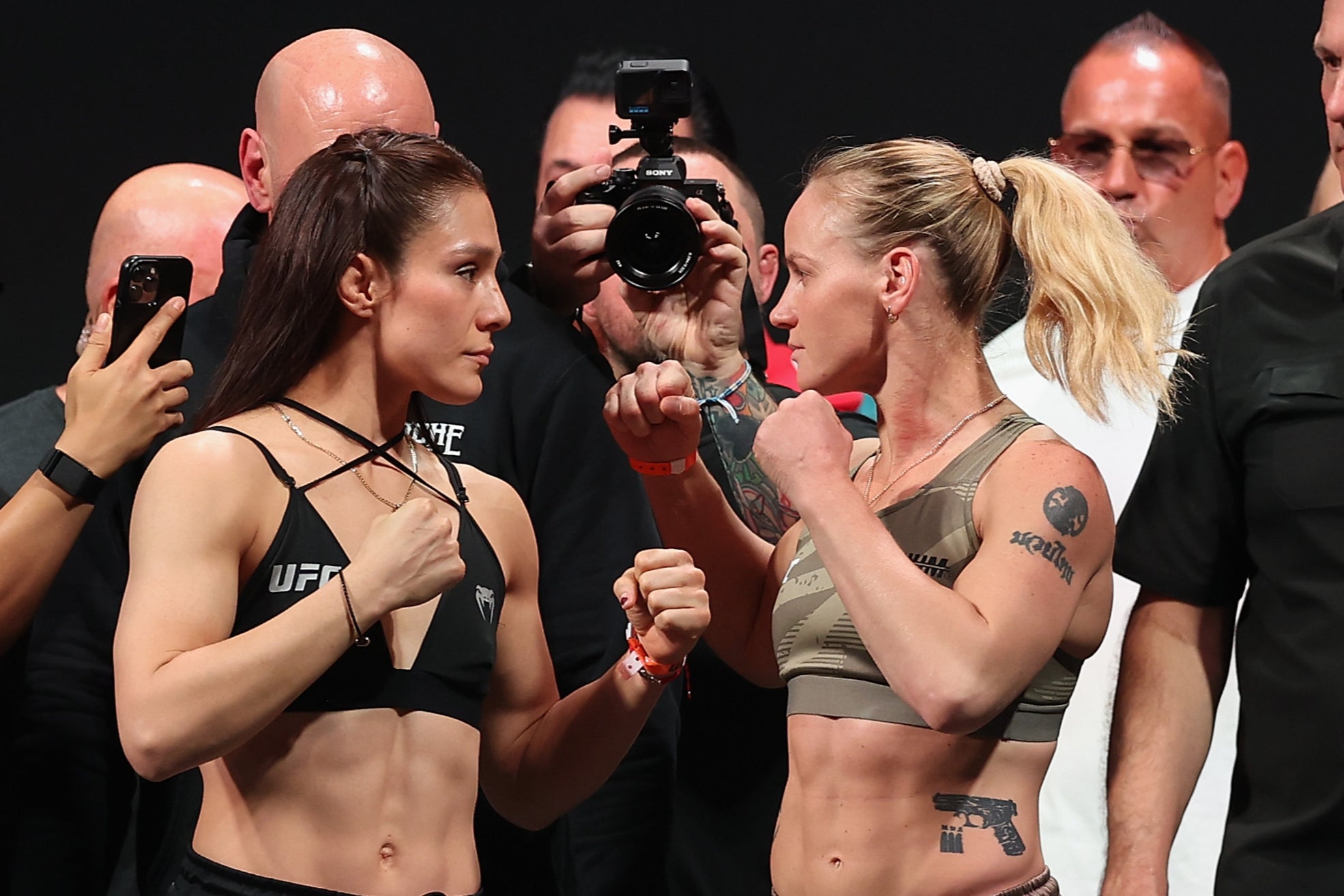 Alexa Grasso (left) faces off with challenger Valentina Shevchenko before UFC 306