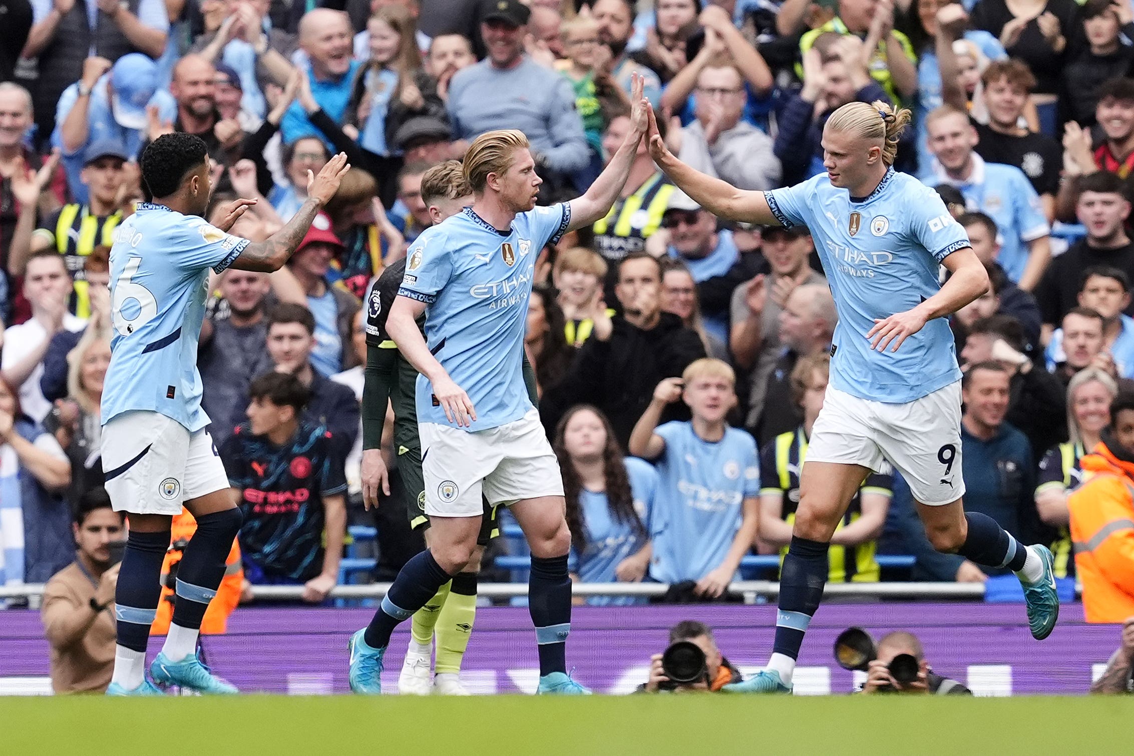 Erling Haaland, right, scored twice as Manchester City earned a fourth straight Premier League victory (Nick Potts/PA)