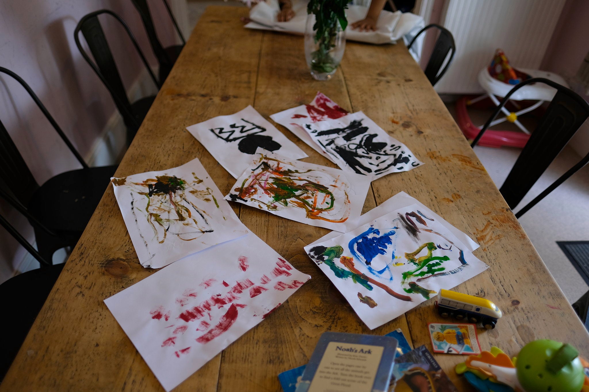 Children’s paintings on a table at the refuge