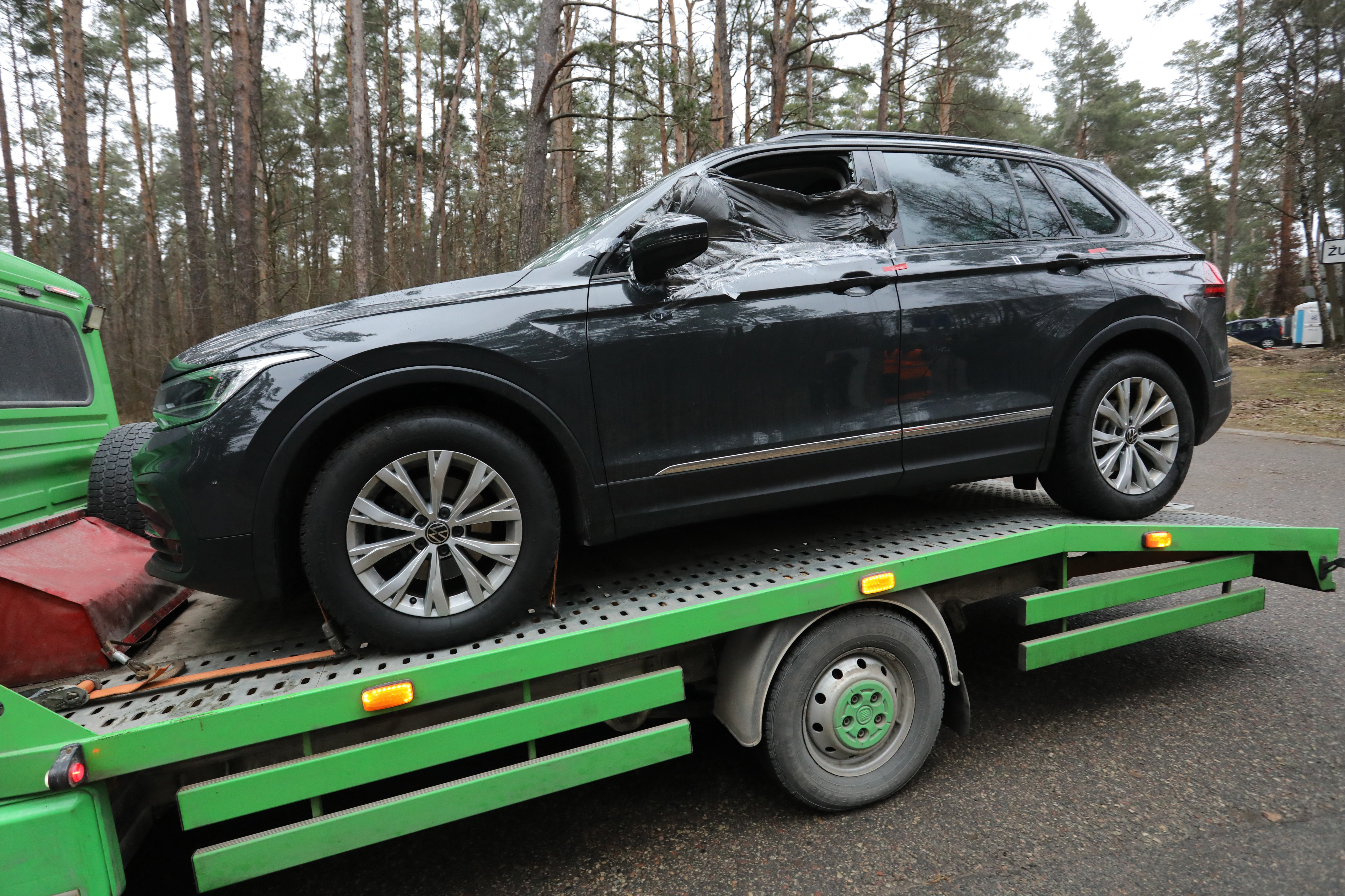 Volkov’s car is taken away after the attack outside his home earlier this year