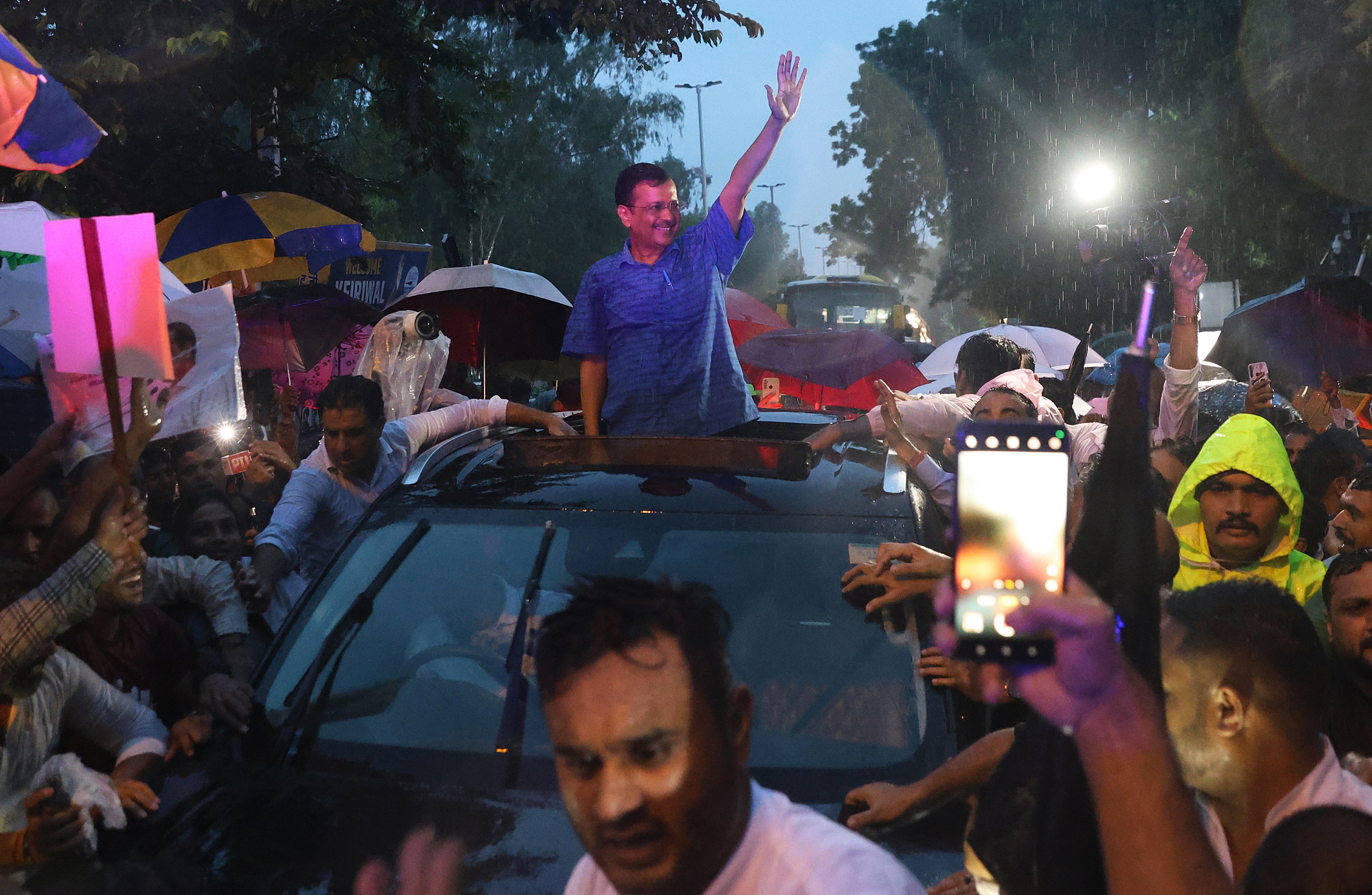 Delhi chief minister and Aam Aadmi Party's (AAP) national convenor Arvind Kejriwal waves to his supporters after his release from Tihar jail