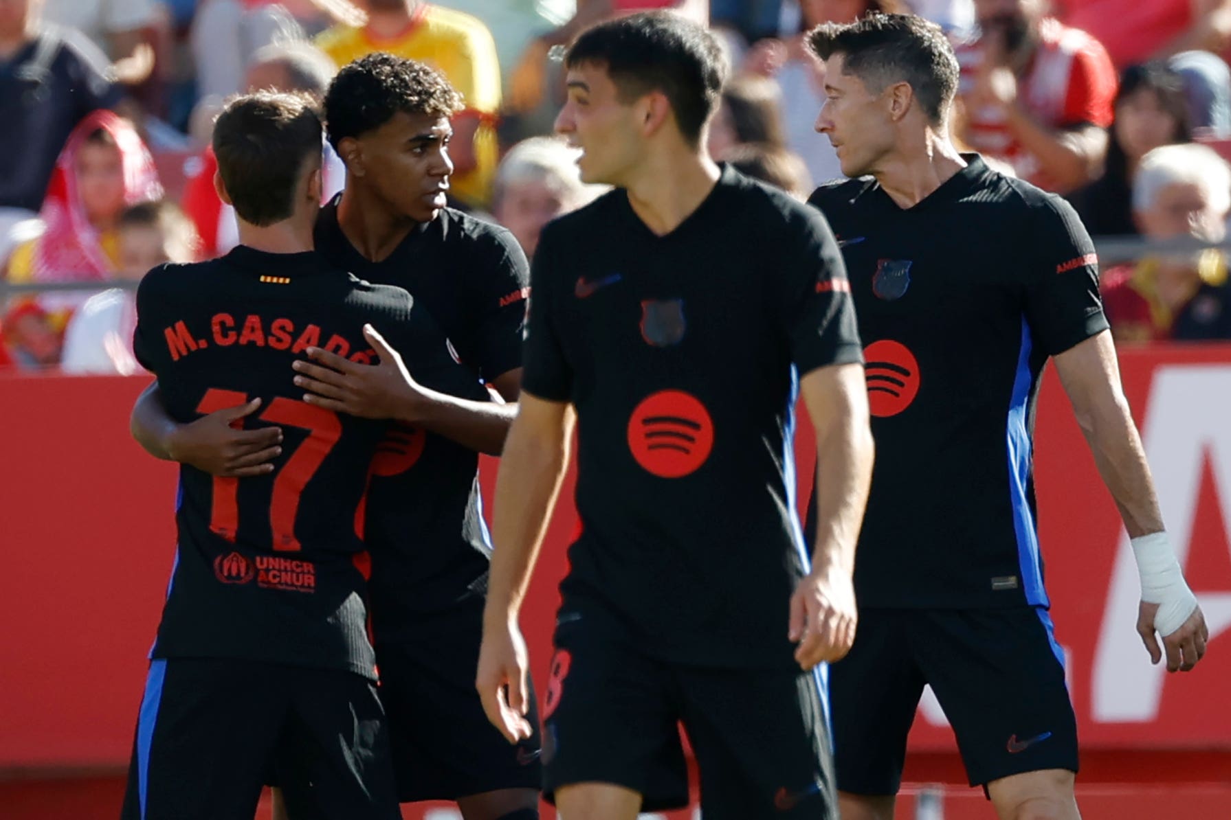 Barcelona’s Lamine Yamal, second left, celebrates his opening goal against Girona (Joan Monfort/AP)