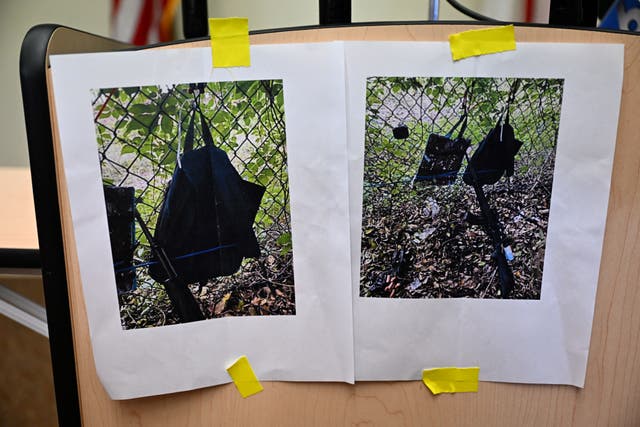 <p>Pictures of evidence found at the fence of US president Donald Trump's golf course are shown at a press conference in West Palm Beach, Florida</p>