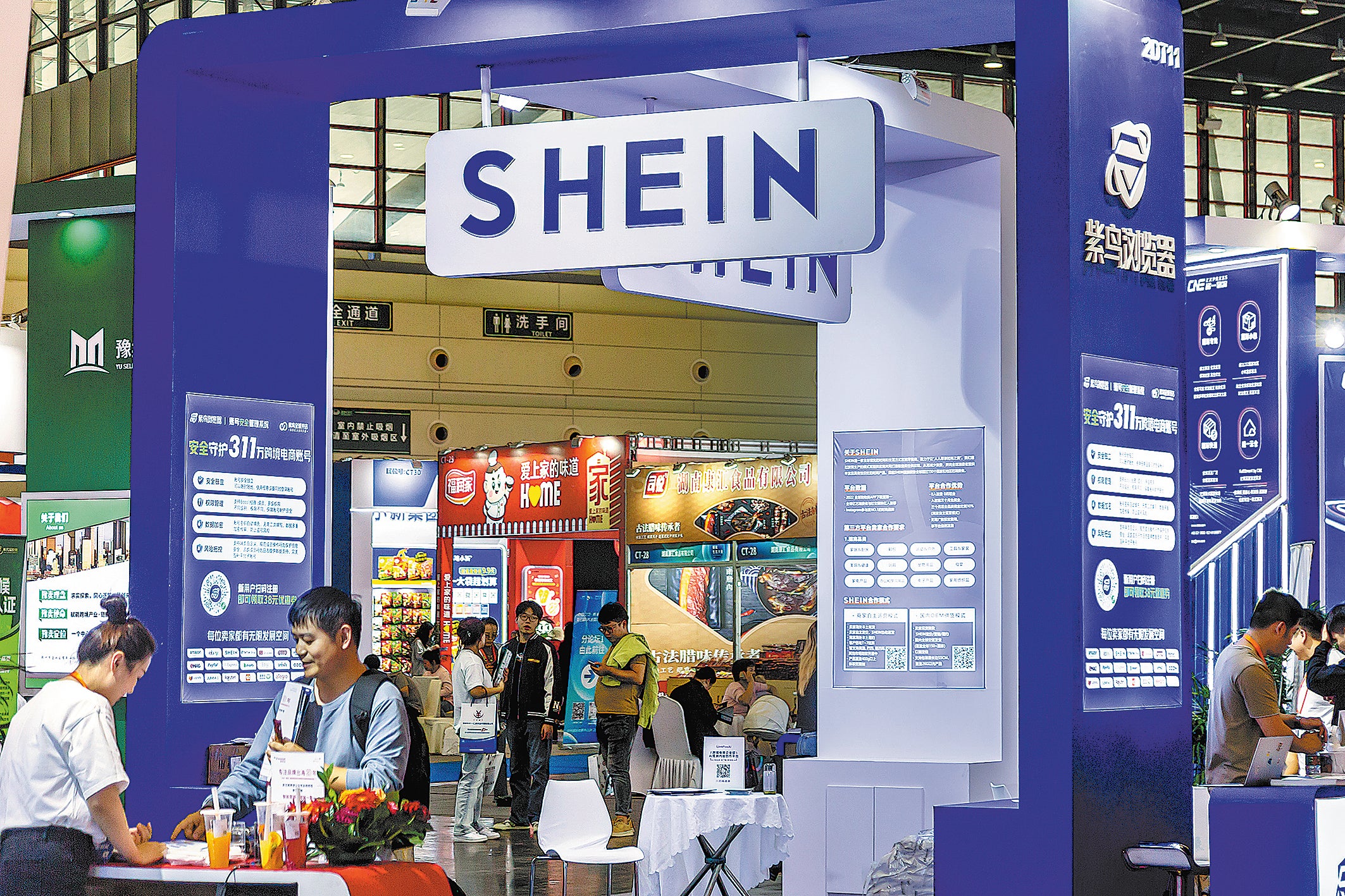 Visitors gather at online retailer Shein’s booth during an expo in Zhengzhou, Henan province