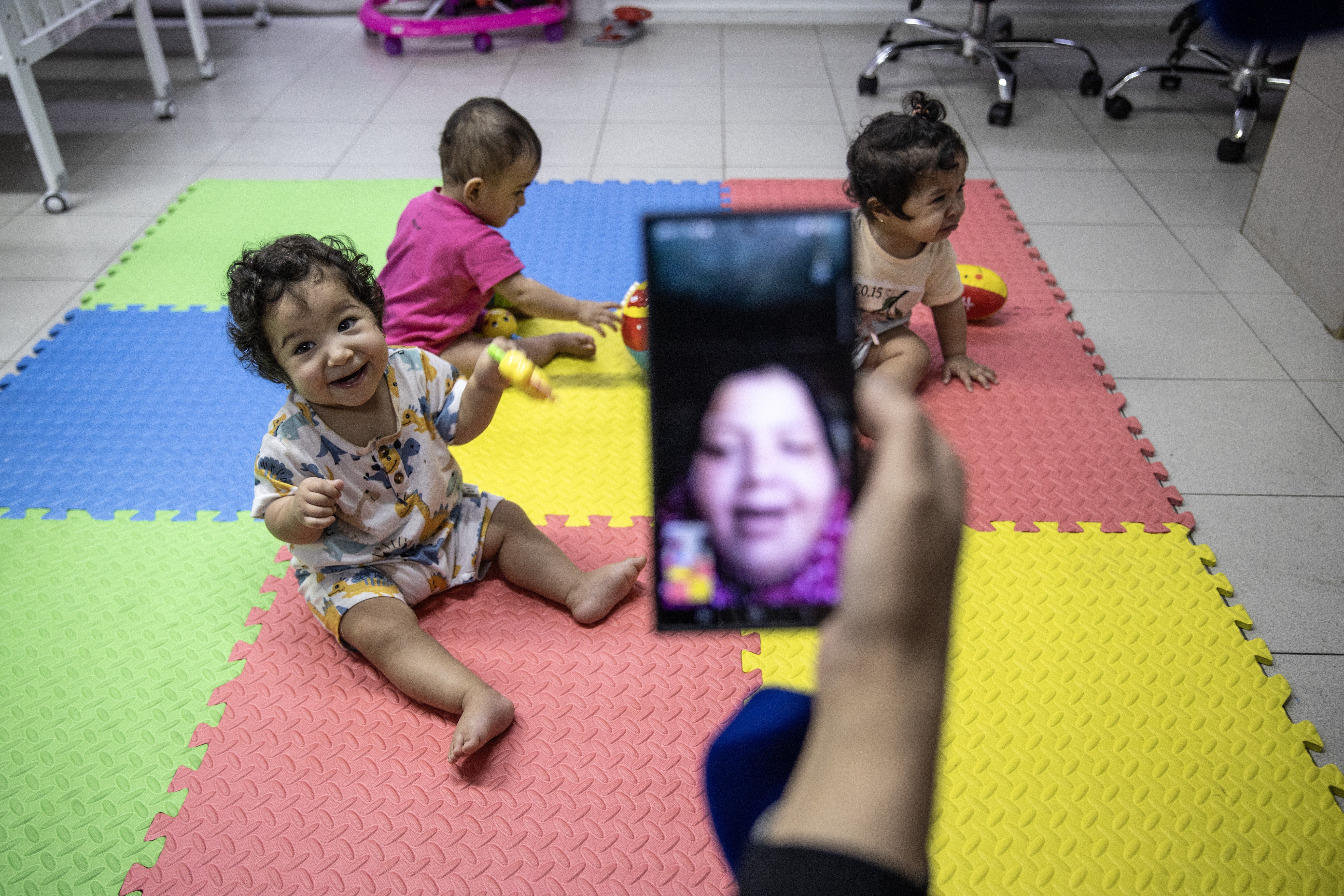 Henan Lidyuk, the mother of triplets Najwan, Najme and Nur, has video calls with her babies thanks to social workers as three Palestinian mothers from the Gaza Strip gave birth to five babies in August-September 2023 at Makassed Hospital in Jerusalem on August 27, 2024