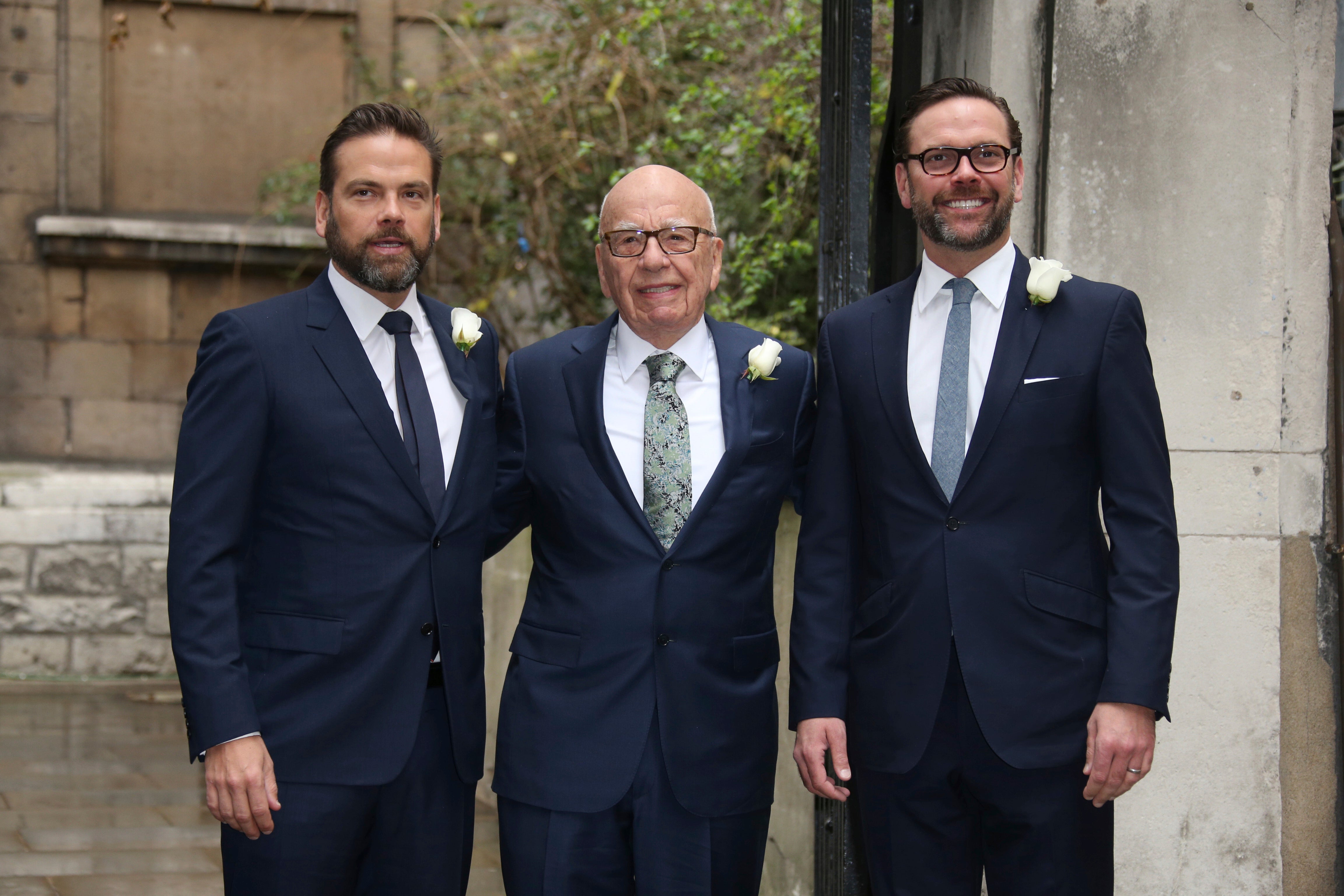 Lachlan Murdoch, Rupert Murdoch and James Murdoch arrive at St. Bride's Church for the celebration ceremony of the wedding of Rupert Murdoch and Jerry Hall.