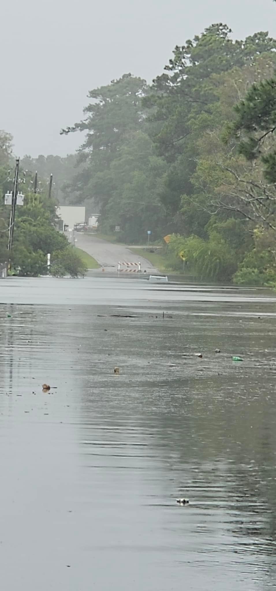 Flooding fills a road in Southport, North Carolina. Tropical storm conditions are forecast to diminish thrrough the afternoon