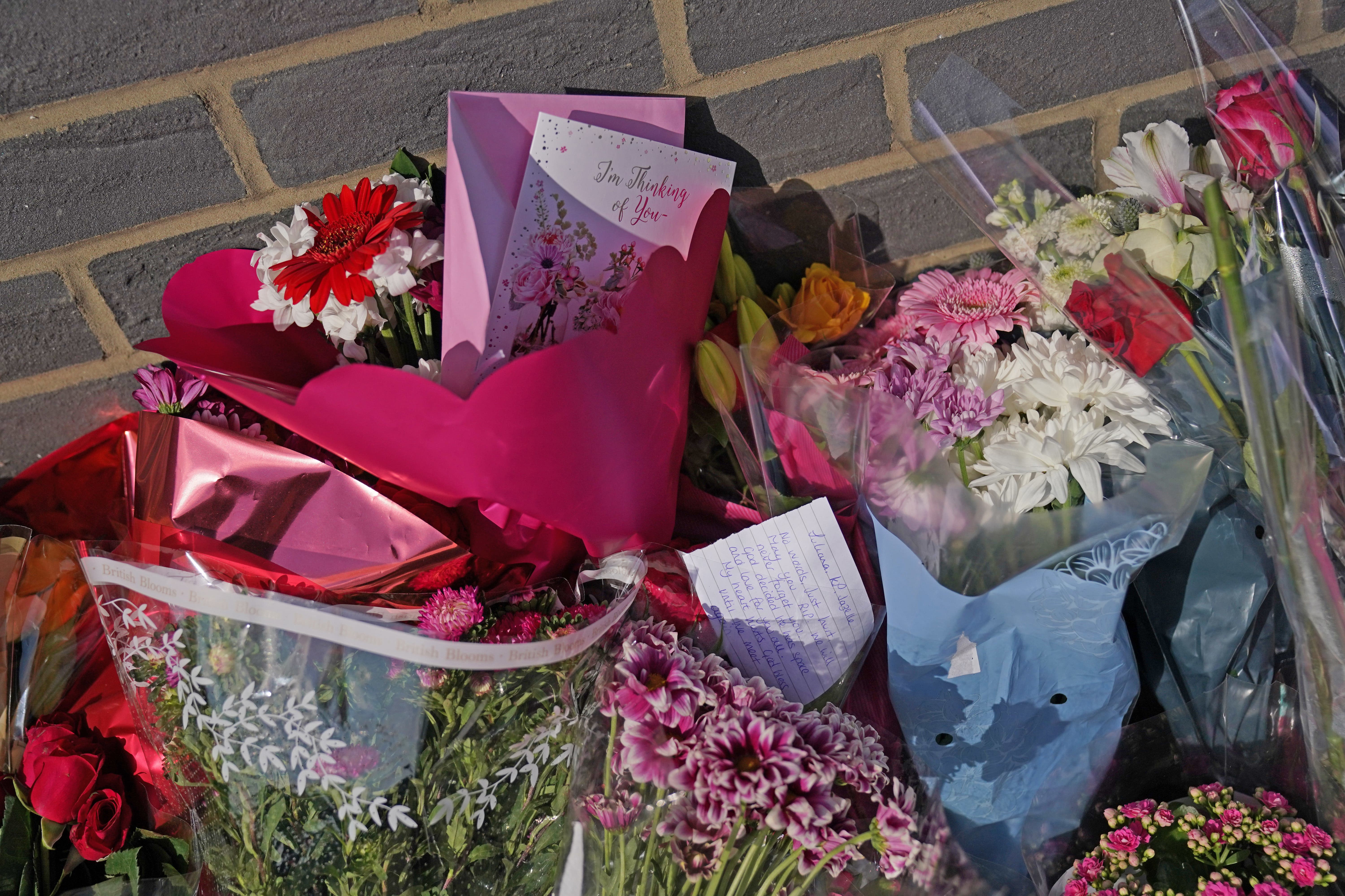 Floral tributes at Leabank in Luton (Jacob King/PA)