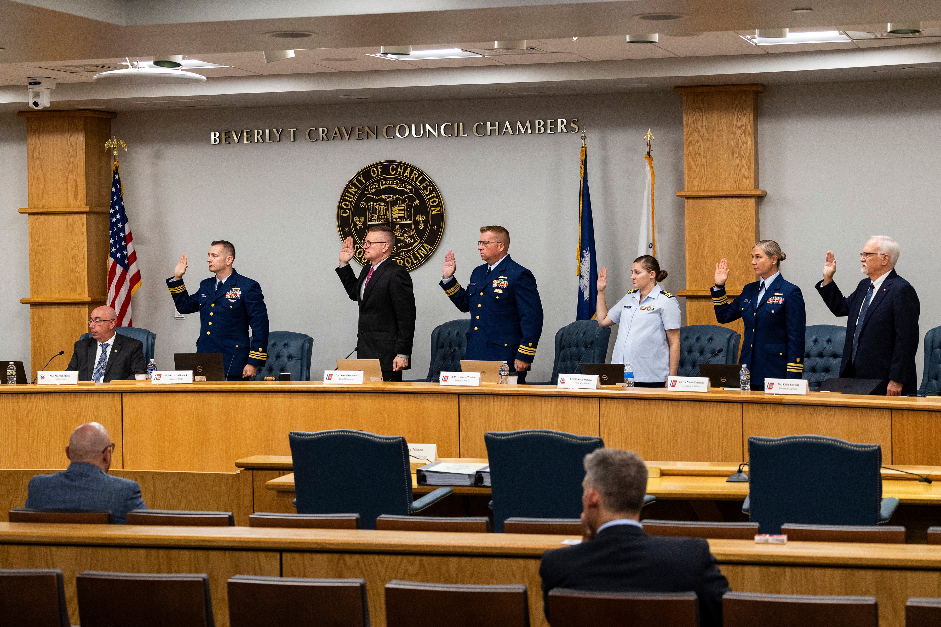 Coast Guard members of the investigative board for the Titan marine board formal hearing take an oath