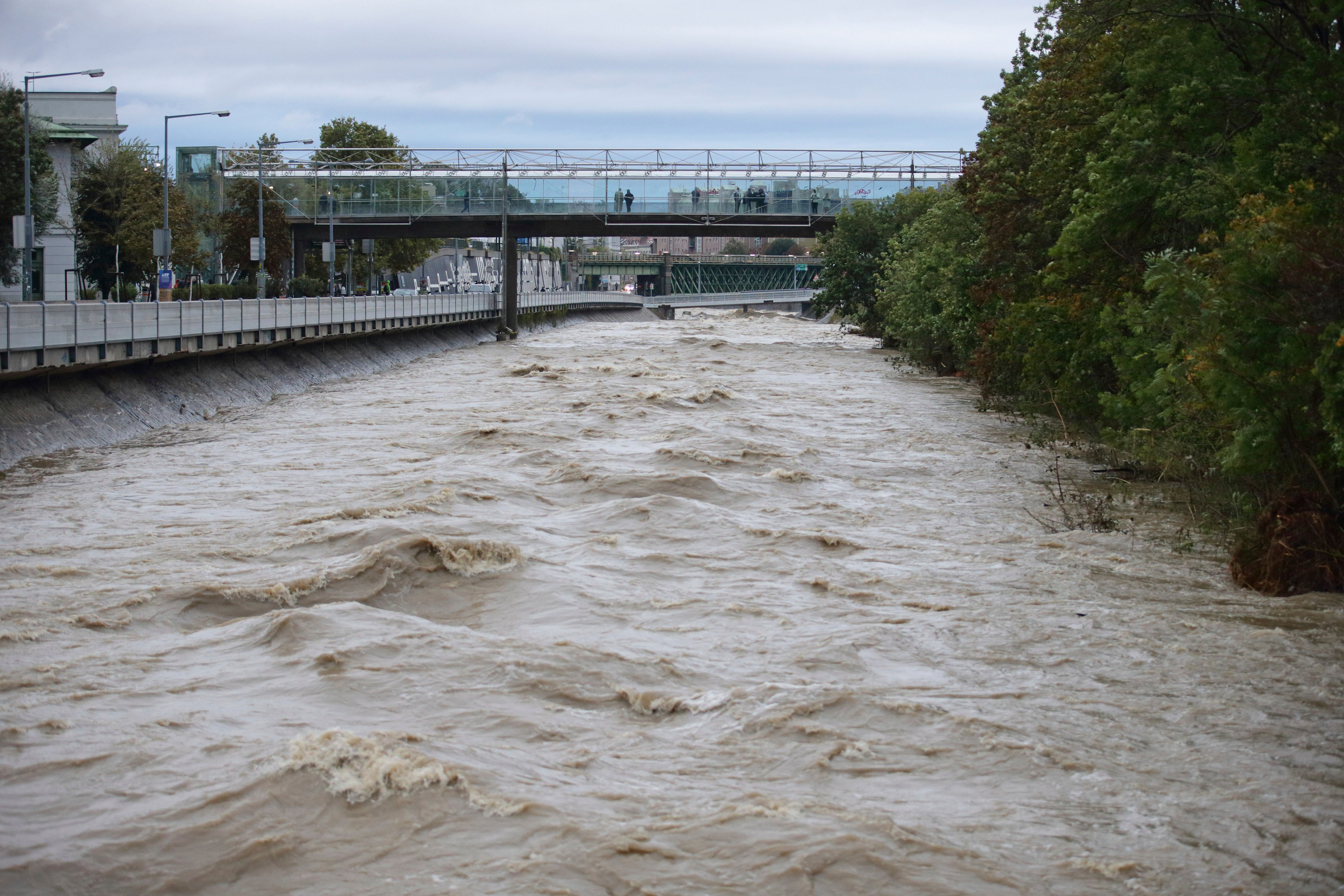 River Wien floods its banks in the west of Vienna, Austria