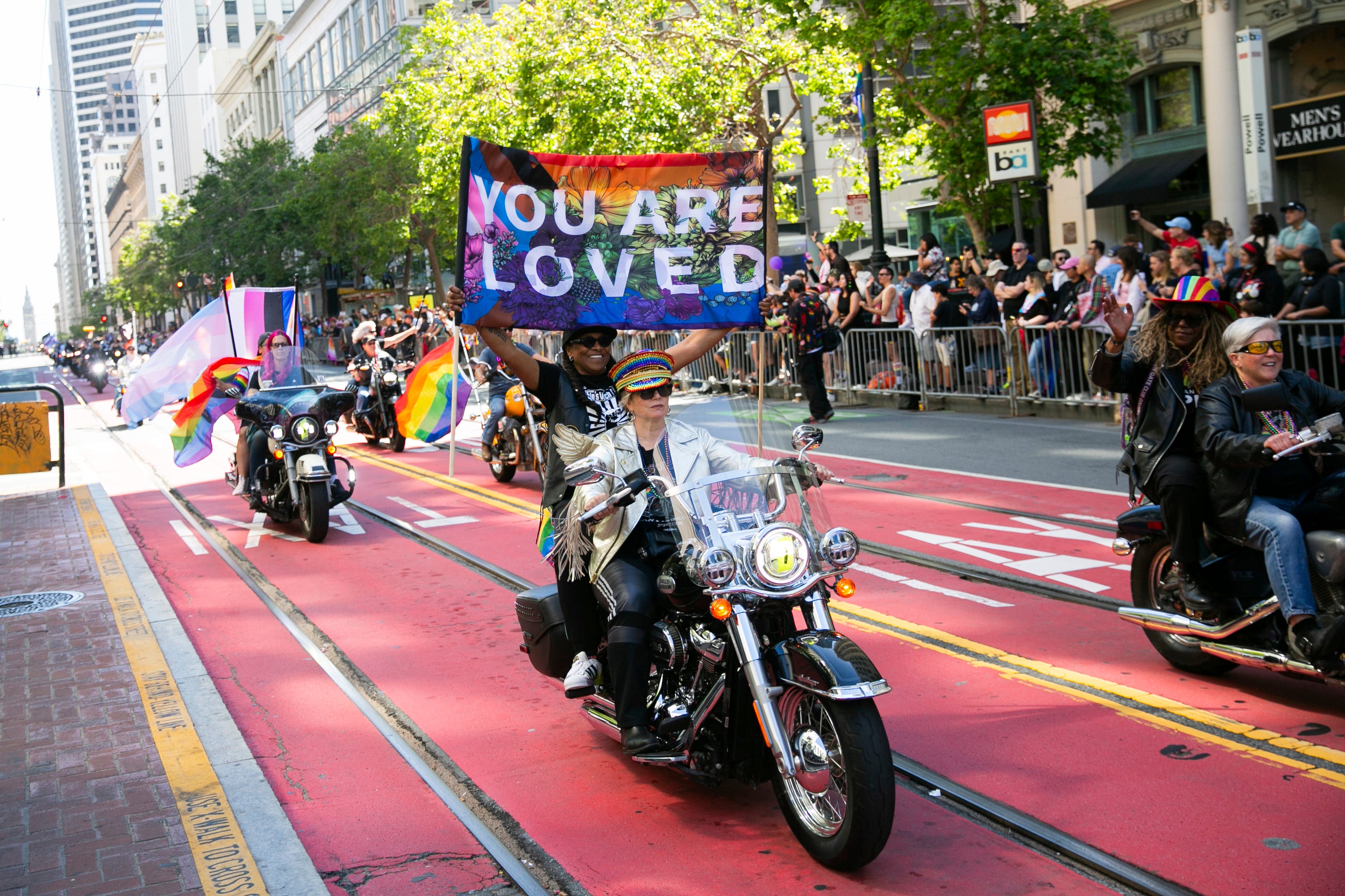 Bikers, center, ride a Harley Davidson motorcycle in the annual Pride Parade in San Francisco June 30, 2024