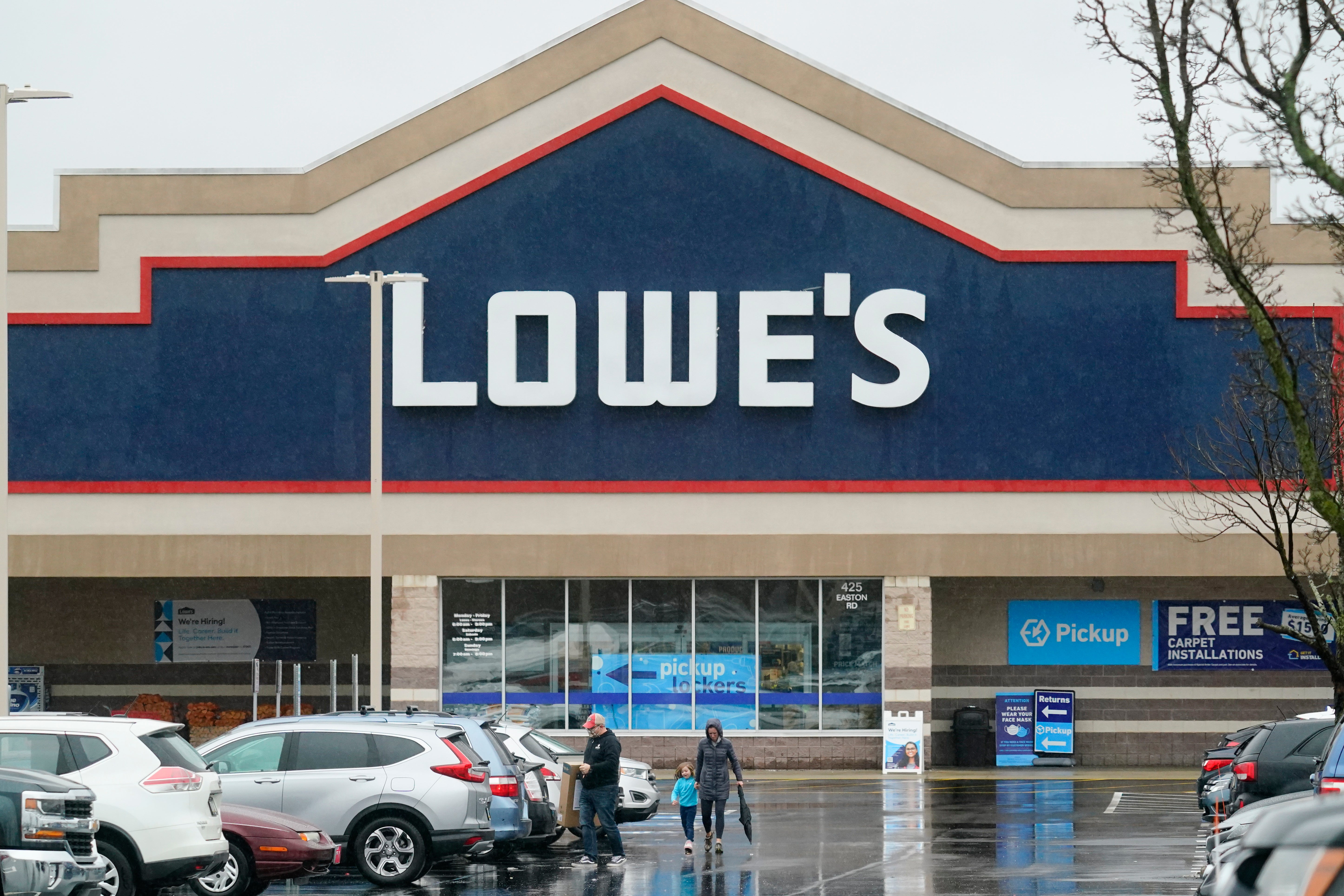 DEI Shoppers exit a Lowe’s in Warrington, Pa., Feb. 4, 2022