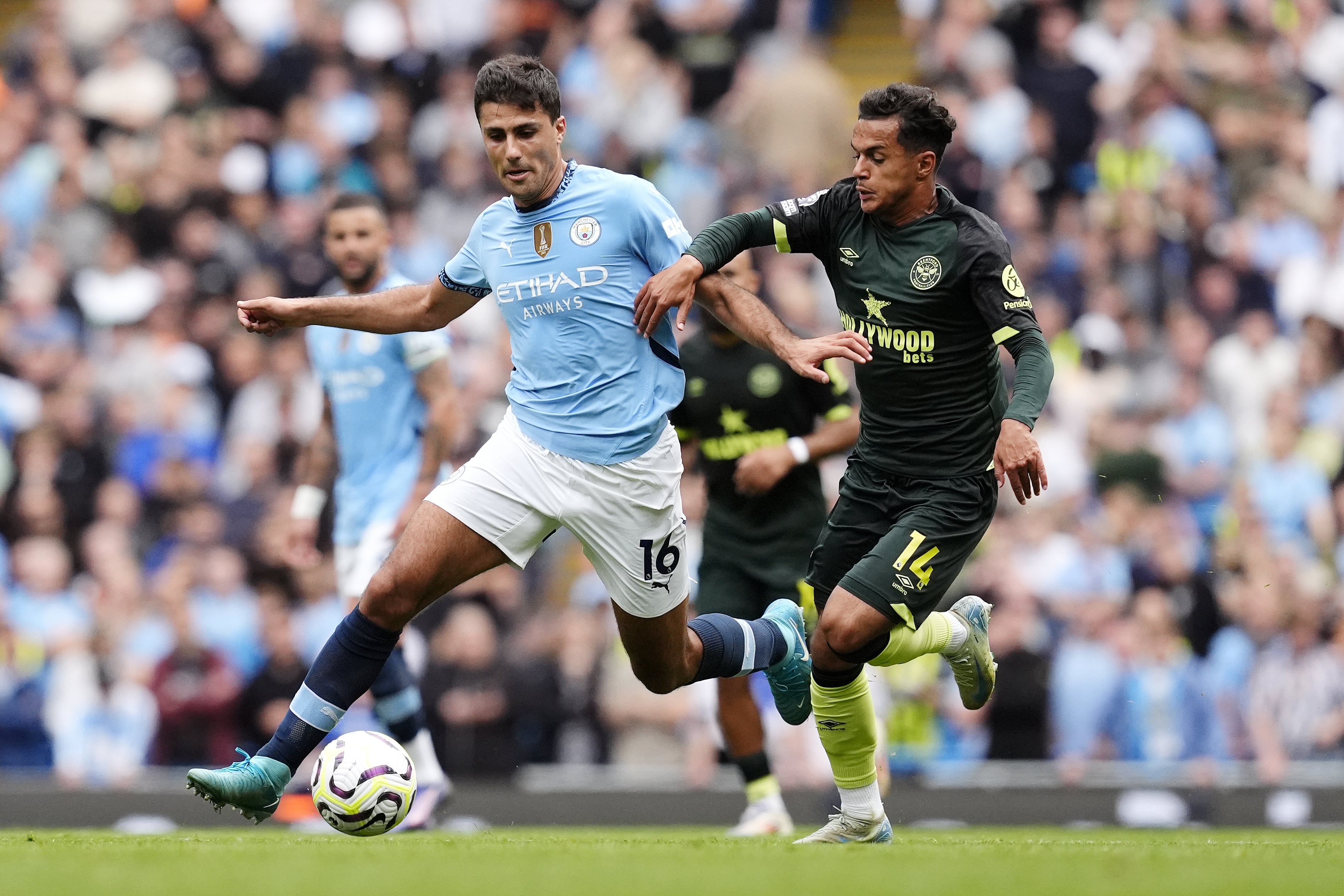 Rodri (left) and Brentford’s Fabio Carvalho battle for the ball during Manchester City’s 2-1 win