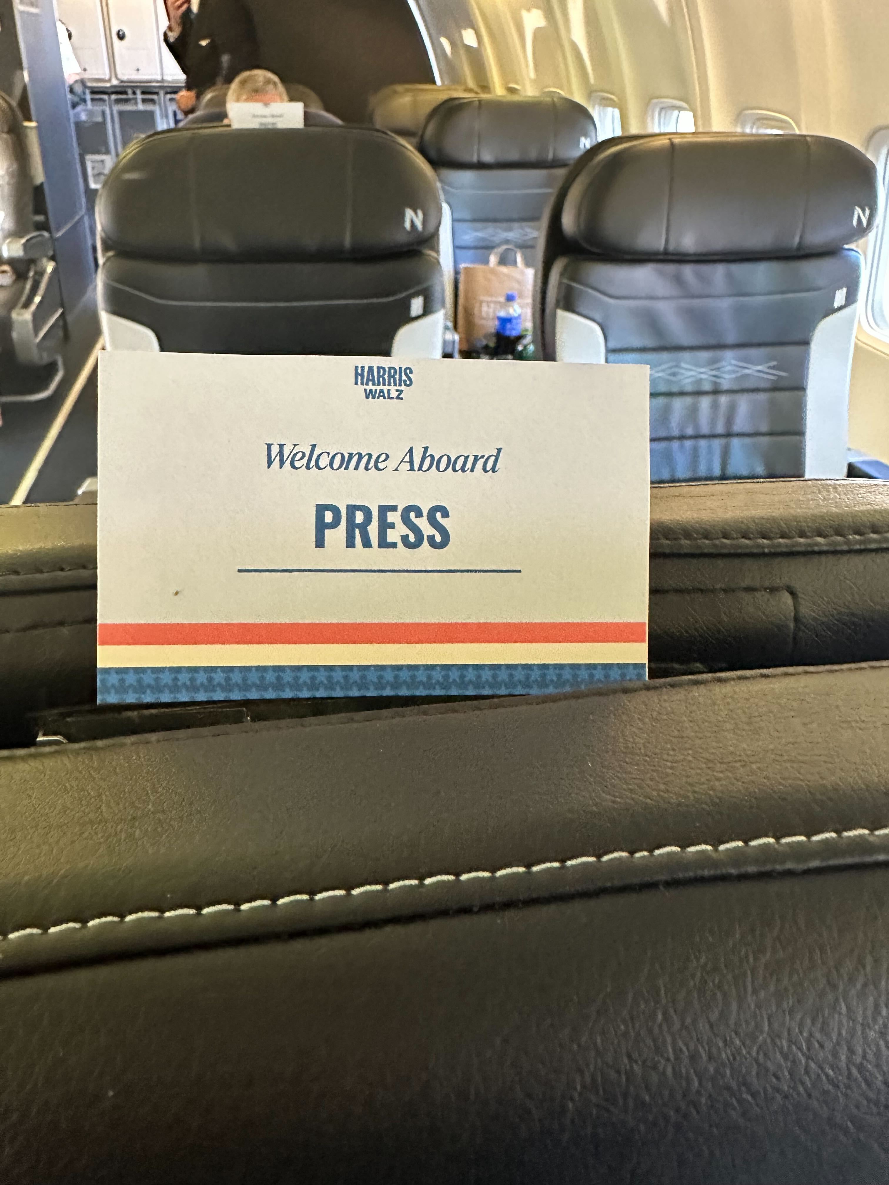 On the plane with Tim Walz this week, the press cabin was separated by numerous rows from Walz and his security details