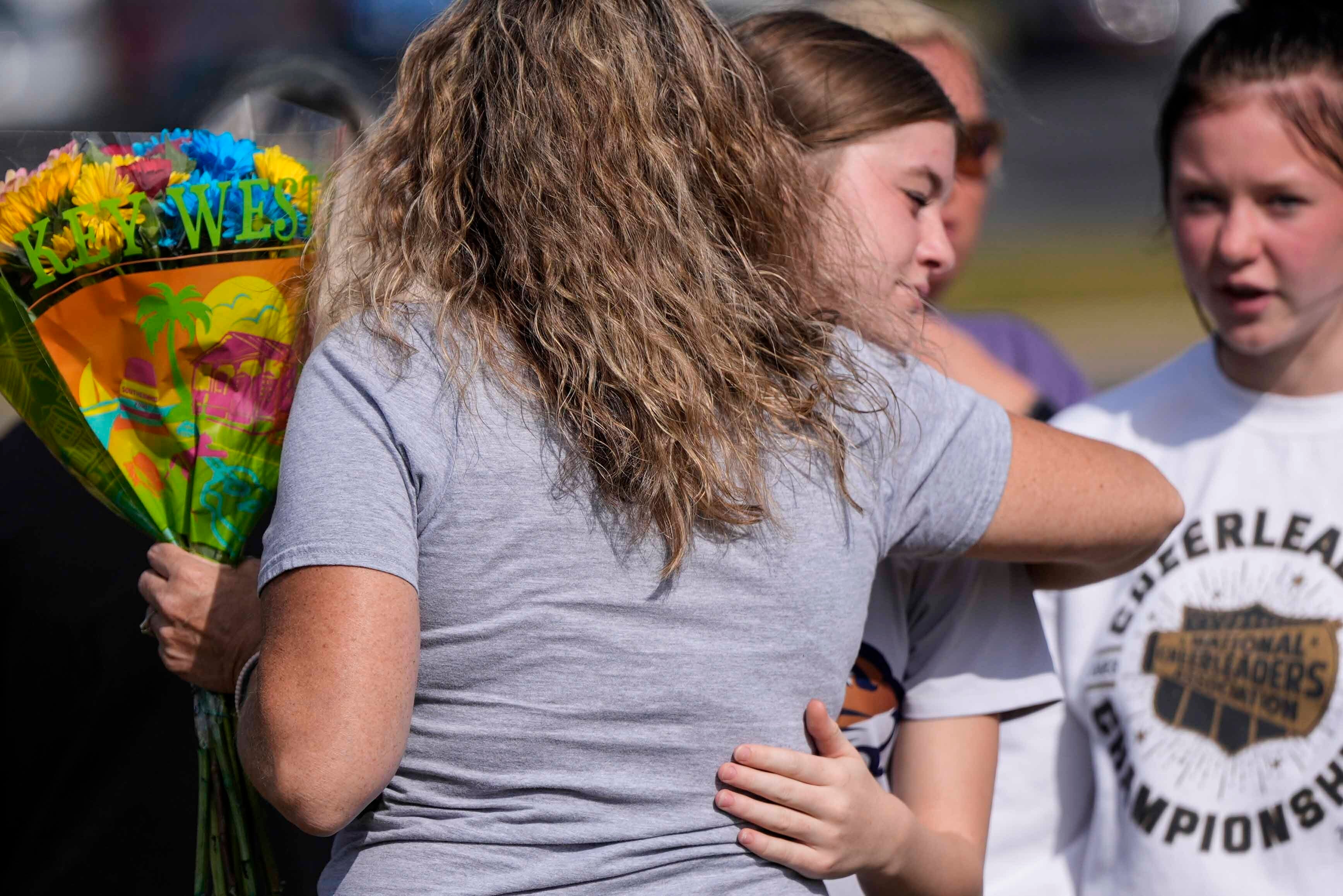 Apalachee High School students mourn after two students and two teachers were killed in a shooting in September.