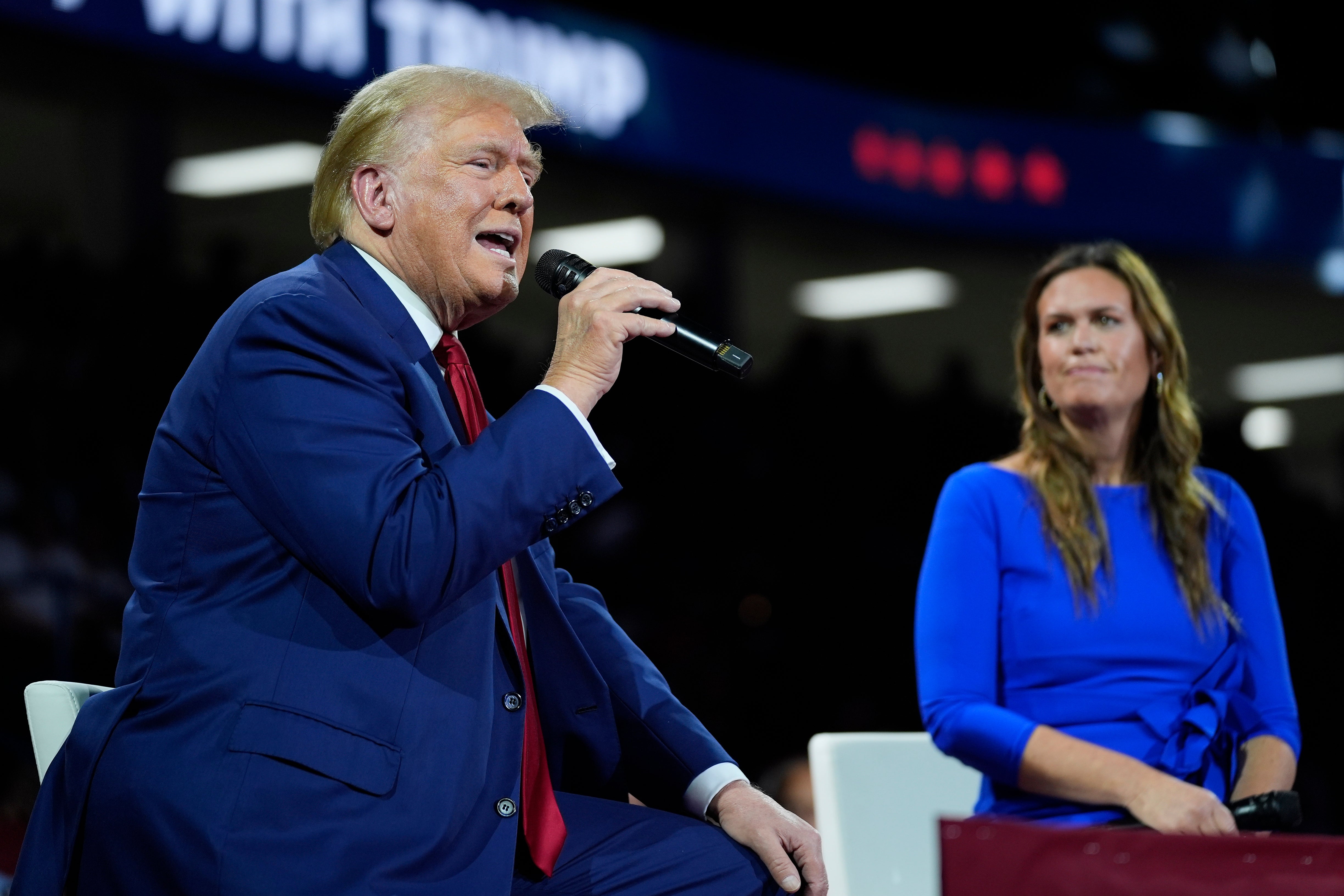 Republican presidential candidate Donald Trump on stage with Arkansas Governor Sarah Huckabee Sanders during a town hall event at the Dort Financial Center in Flint, Michigan, on Tuesday September 18 2024. He spoke about the latest attempt on his life