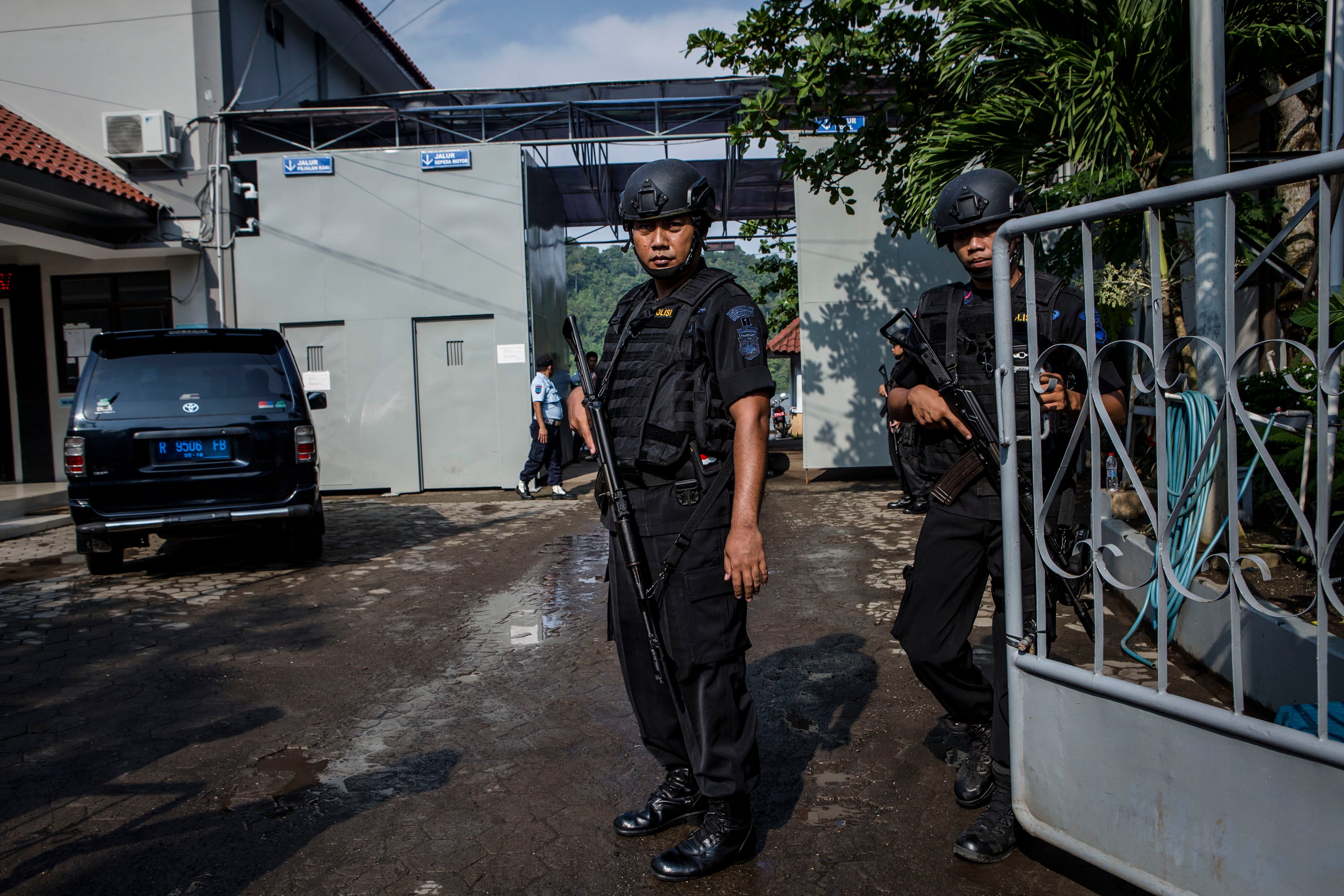 File. Indonesian police stand guard at Wijayapura port, the entrance gate to Nusakambangan prison, ahead of a third round of drug executions in 2016