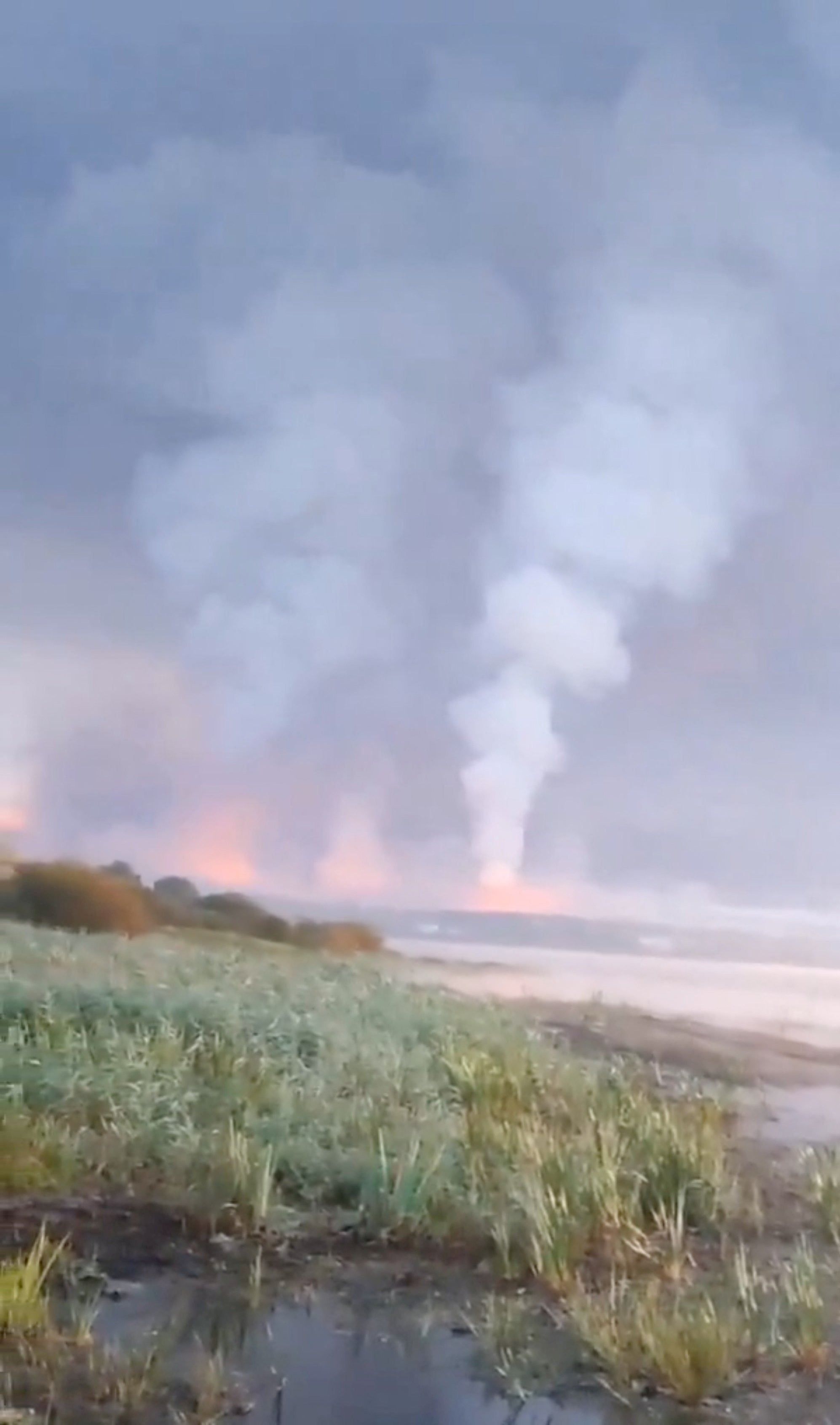 Smoke and flames rise following a Ukrainian drone attack in Toropets