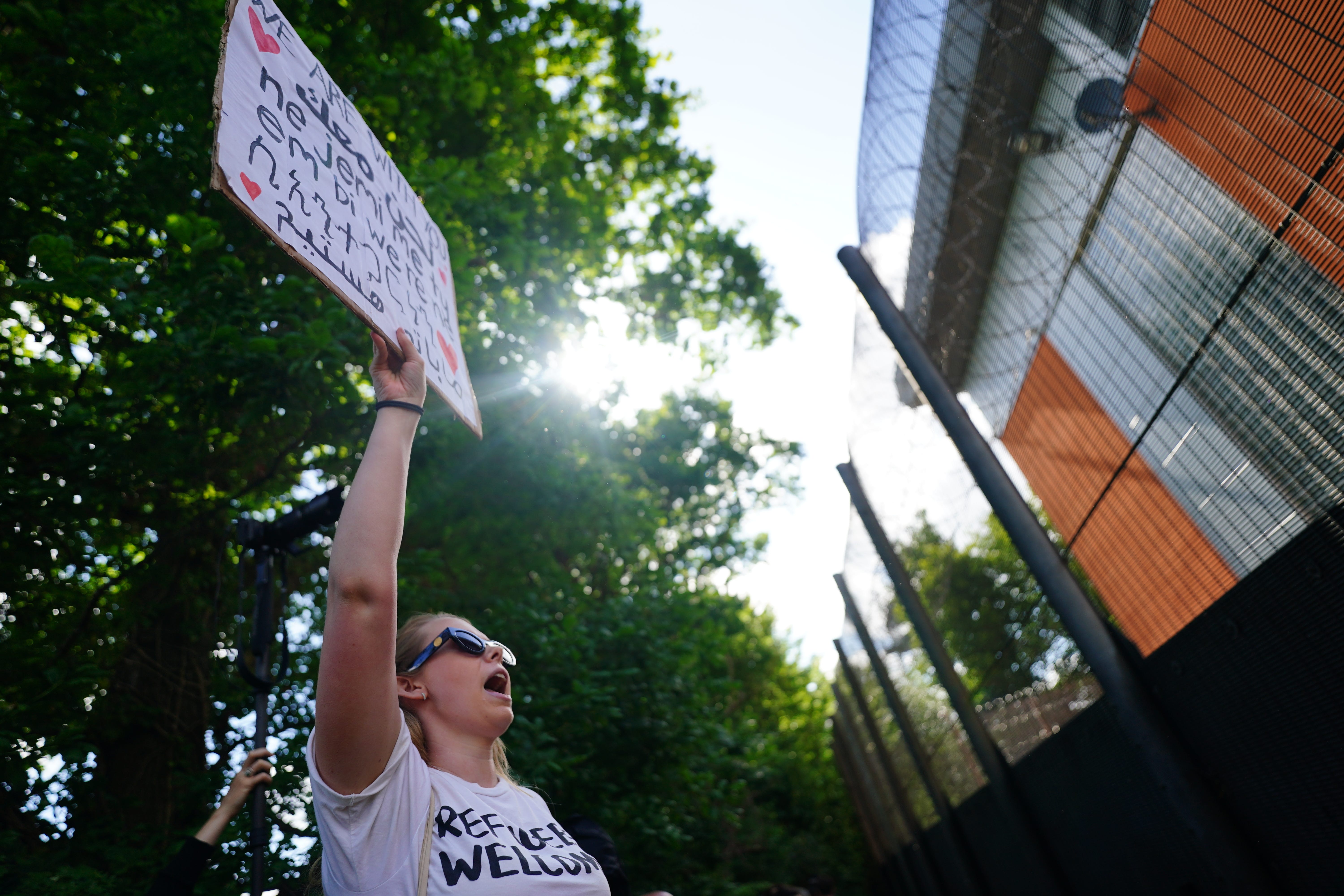 Demonstrators at Brook House Immigration Removal Centre protested against plans to send migrants to Rwanda (Victoria Jones/PA)