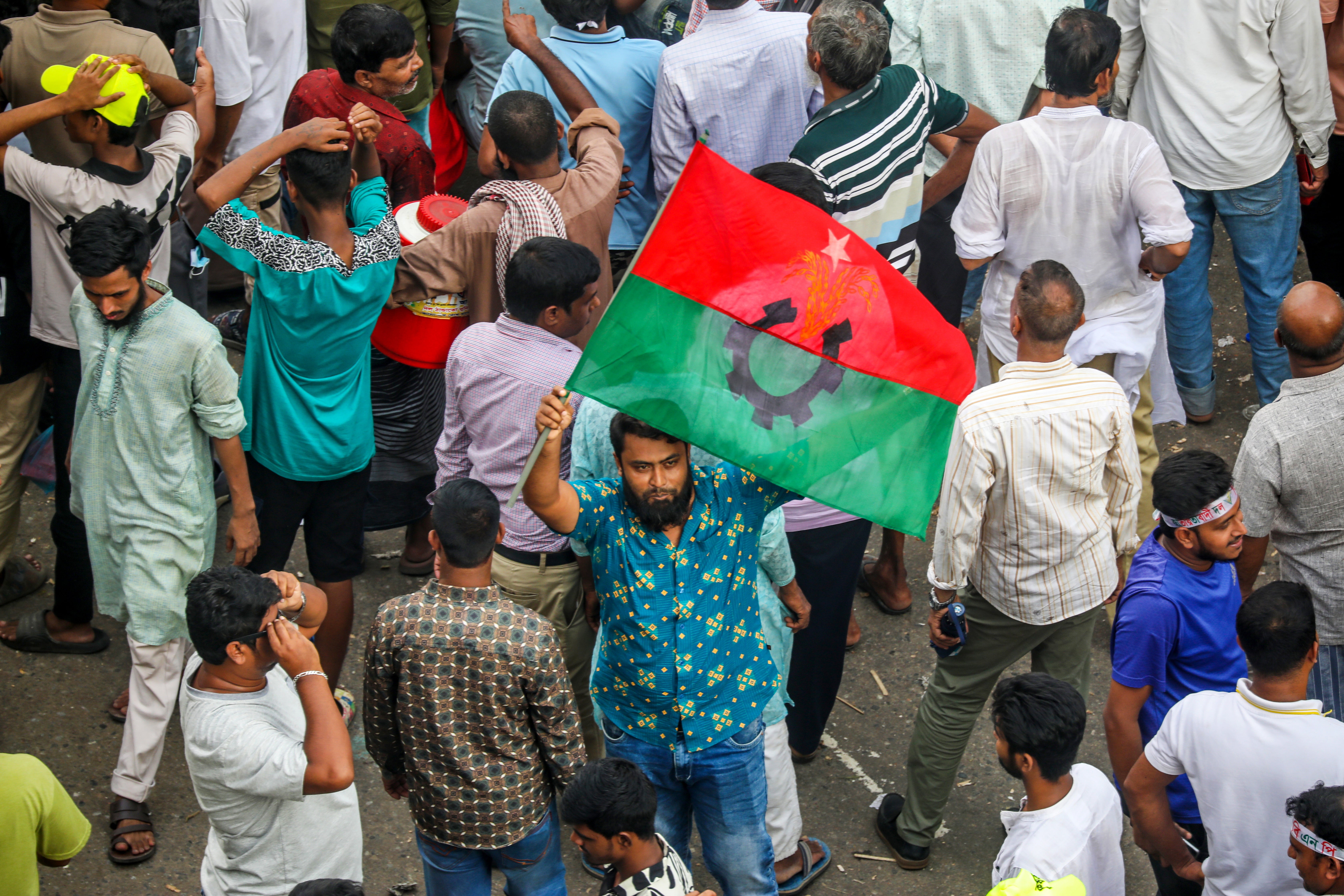 The BNP supporters gathered in Dhaka , where they chanted slogans demanding a new election