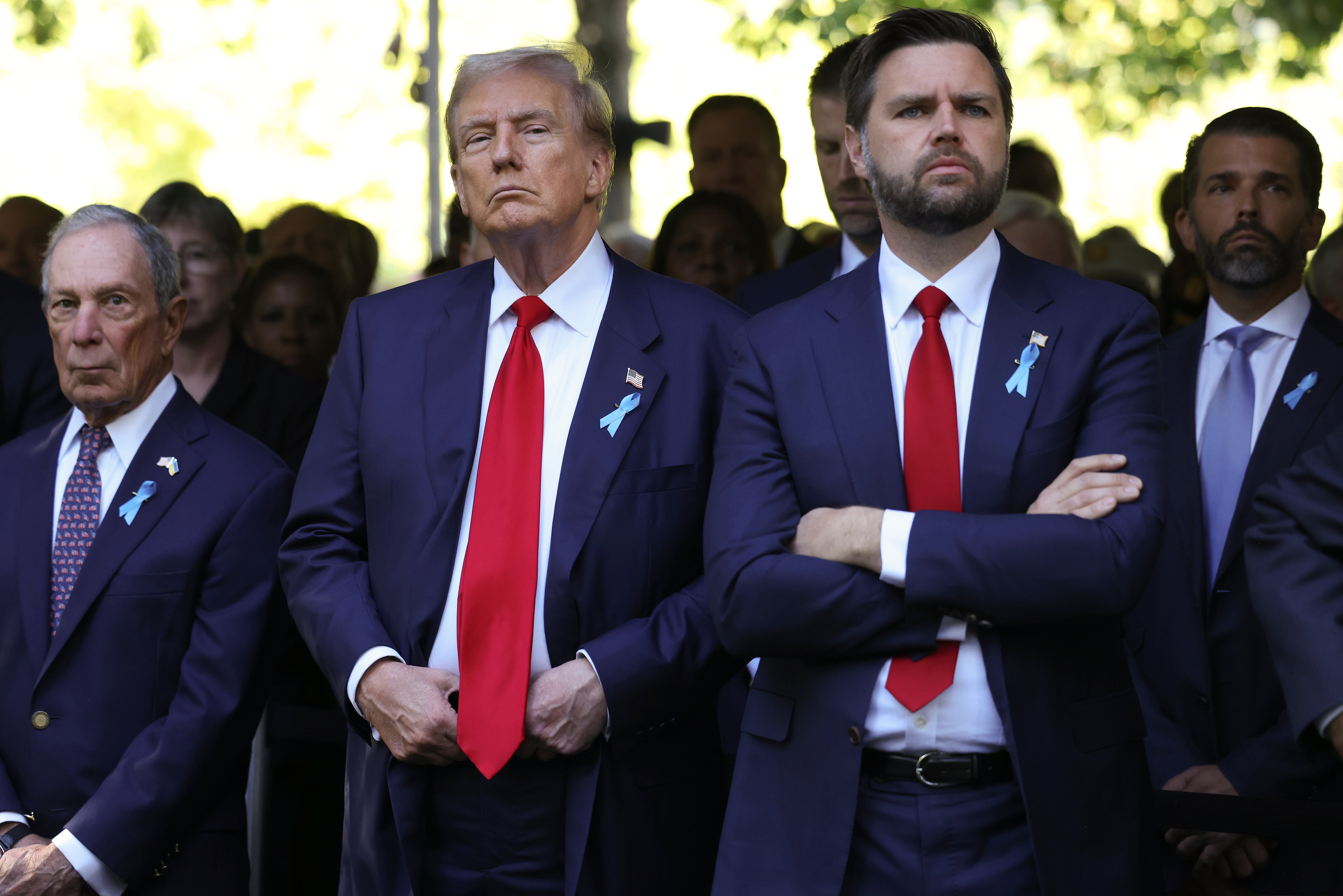 From left, Michael Bloomberg, Republican presidential nominee former President Donald Trump and Republican vice presidential nominee Sen. JD Vance, R-Ohio, attend the 9/11 Memorial ceremony on the 23rd anniversary of the Sept. 11, 2001 attacks, Wednesday, Sept. 11, 2024, in New York. (AP Photo/Yuki Iwamura)