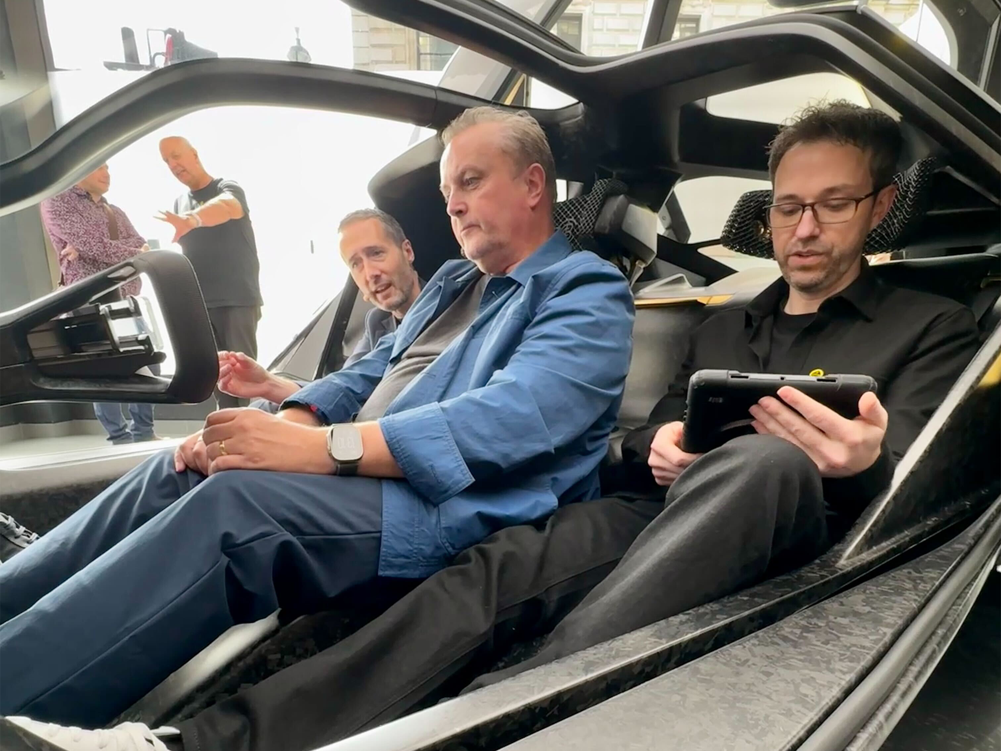 Ben Payne, VP of design at Lotus Group, Ben Quaintance, interior design manager, and Independent motoring critic Steve Fowler behind the wheel of the Lotus Theory 1